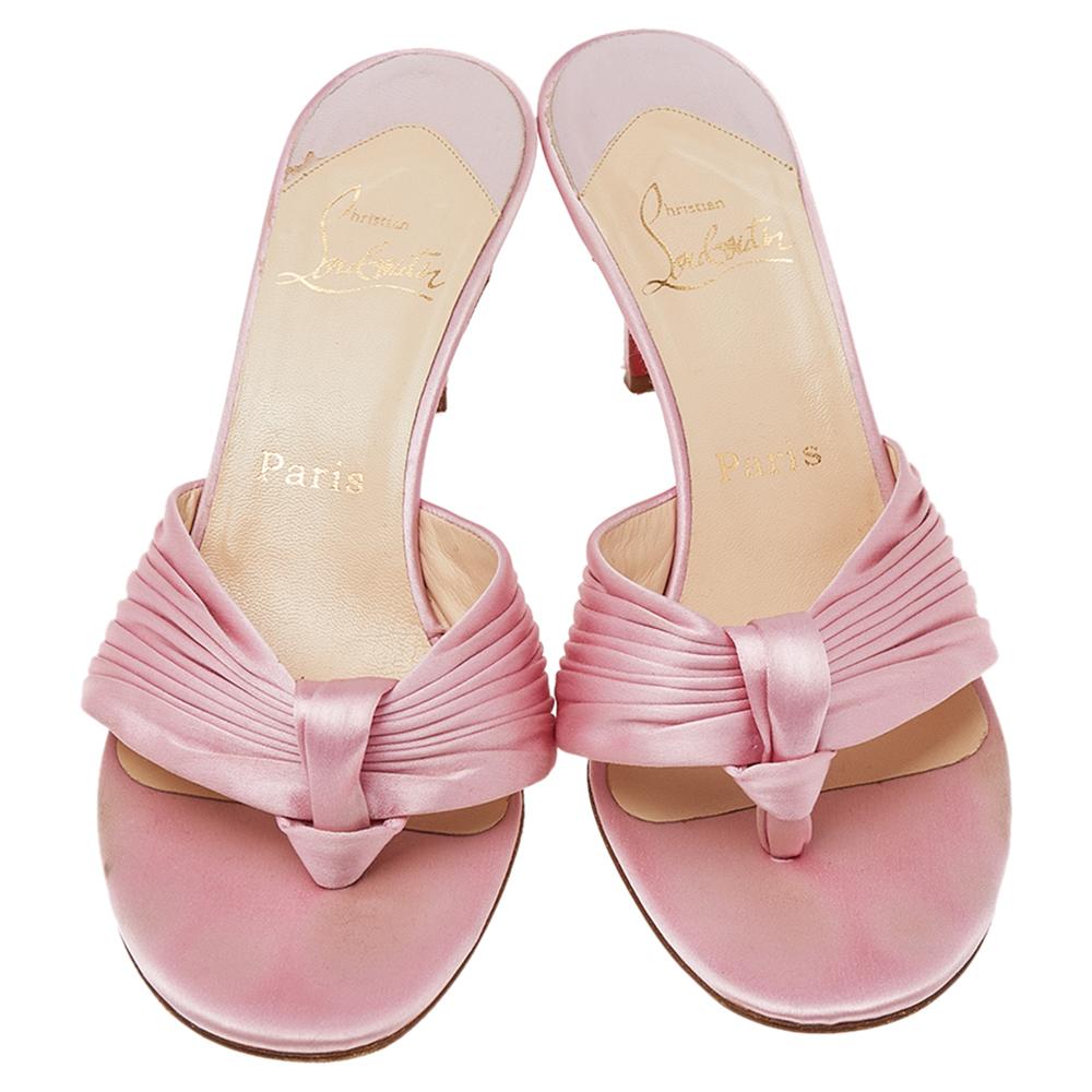 Your style can never go wrong with a dash of pink. These pink sandals from Christian Louboutin speak elegance in their every detail. They are made using pink satin on the upper and are designed in a slip-on style. They flaunt 7.8 cm