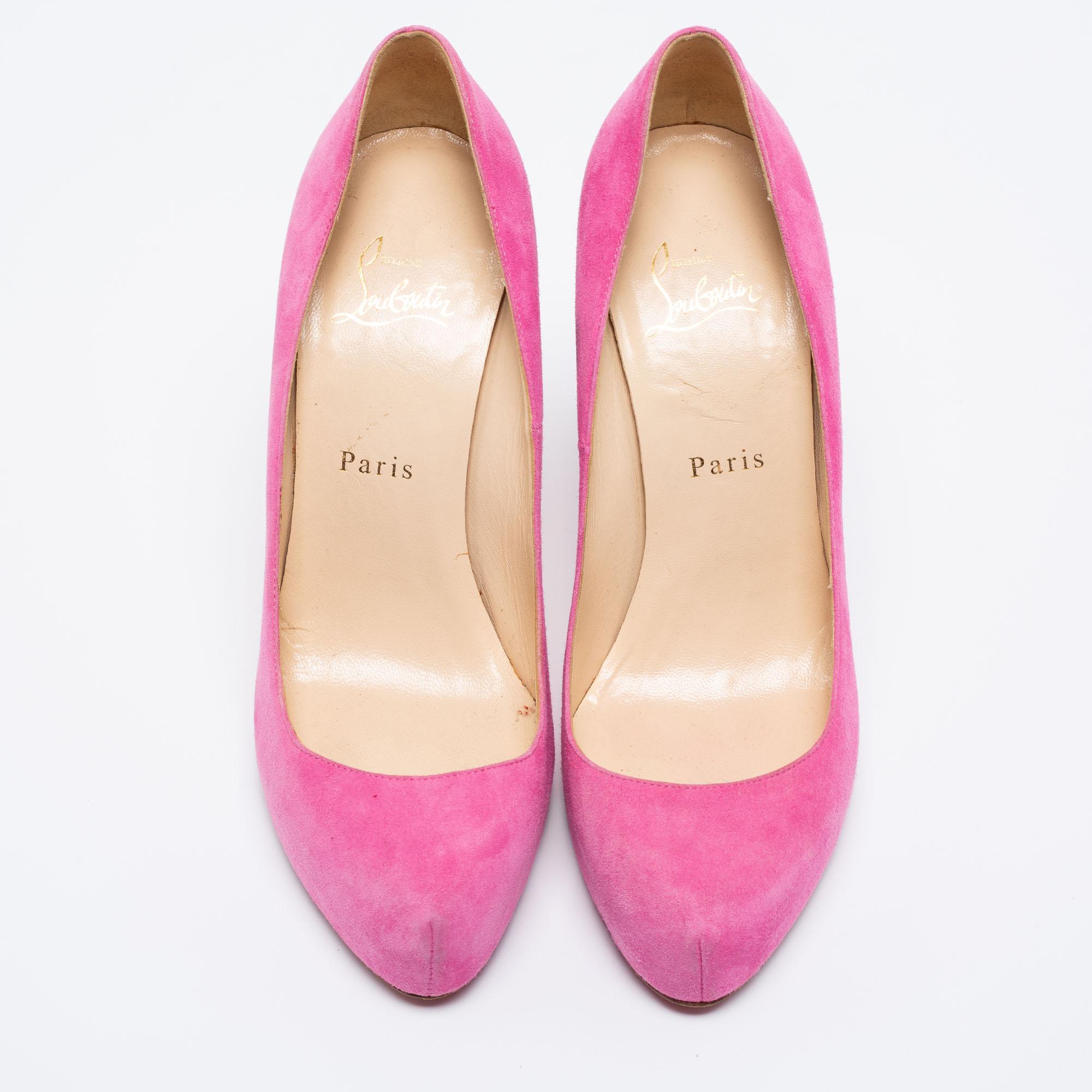 Elegant and charming, these Elisa pumps from Christian Louboutin are a dreamy creation you will love to own. They are made from pink suede and are enriched with rounded toes, slim heels, and a slip-on detail. The red-lacquered soles add a signature
