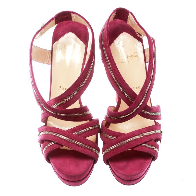 Wear these stylish sandals from the house of Christian Louboutin and channel the inner fashionista in you. These suede sandals are detailed with zippers and lined with soft leather to lend ultimate comfort to you. These trendy pink sandals are