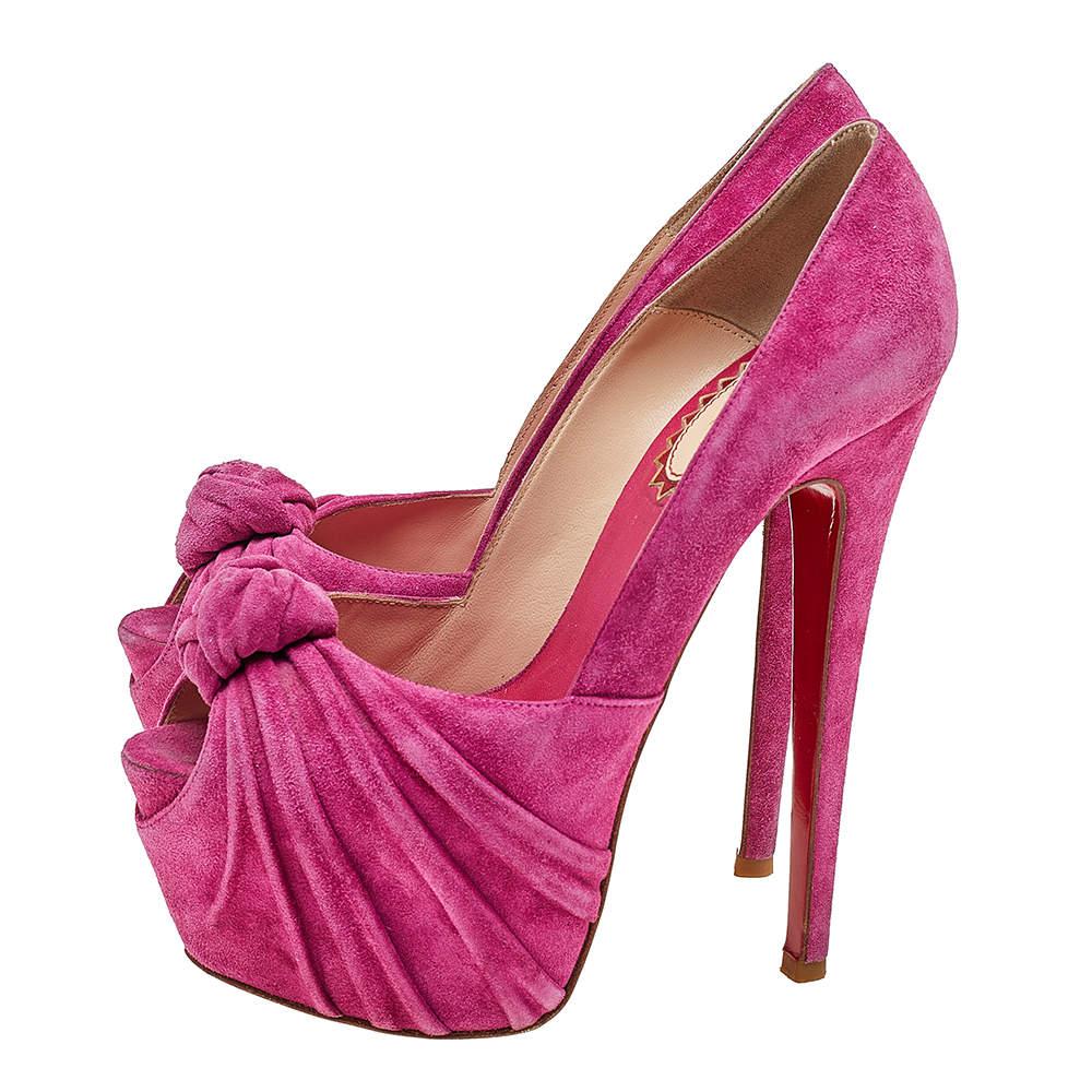 These ravishing pink Lady Gres pumps are a part of the 20th Anniversary Capsule Collection from the much-loved shoe label Christian Louboutin. They are crafted from suede into a peep-toe silhouette and styled with a drape and knot detailing on the