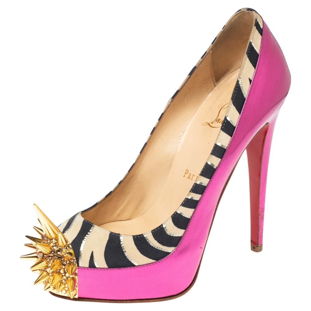 Jazz up your style with these pumps that are crafted from pink patent leather and zebra-print suede. They have spike details in gold-tone metal and slim high heels that add interest. Make a statement when you wear these pumps from the house of