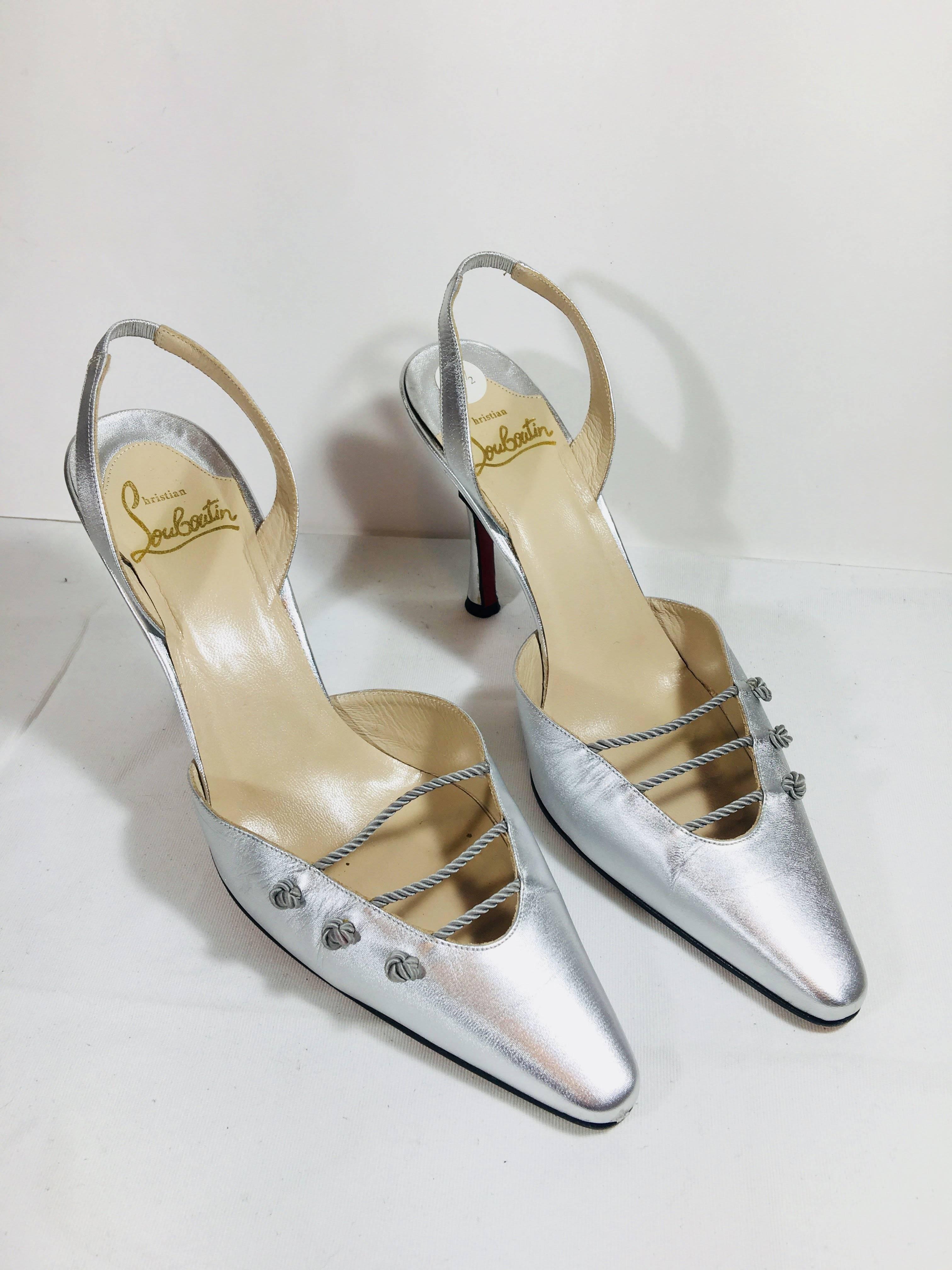 Christian Louboutin Pointed Toe Slingbacks. Metallic Silver Leather with Twist Rope Accent. 