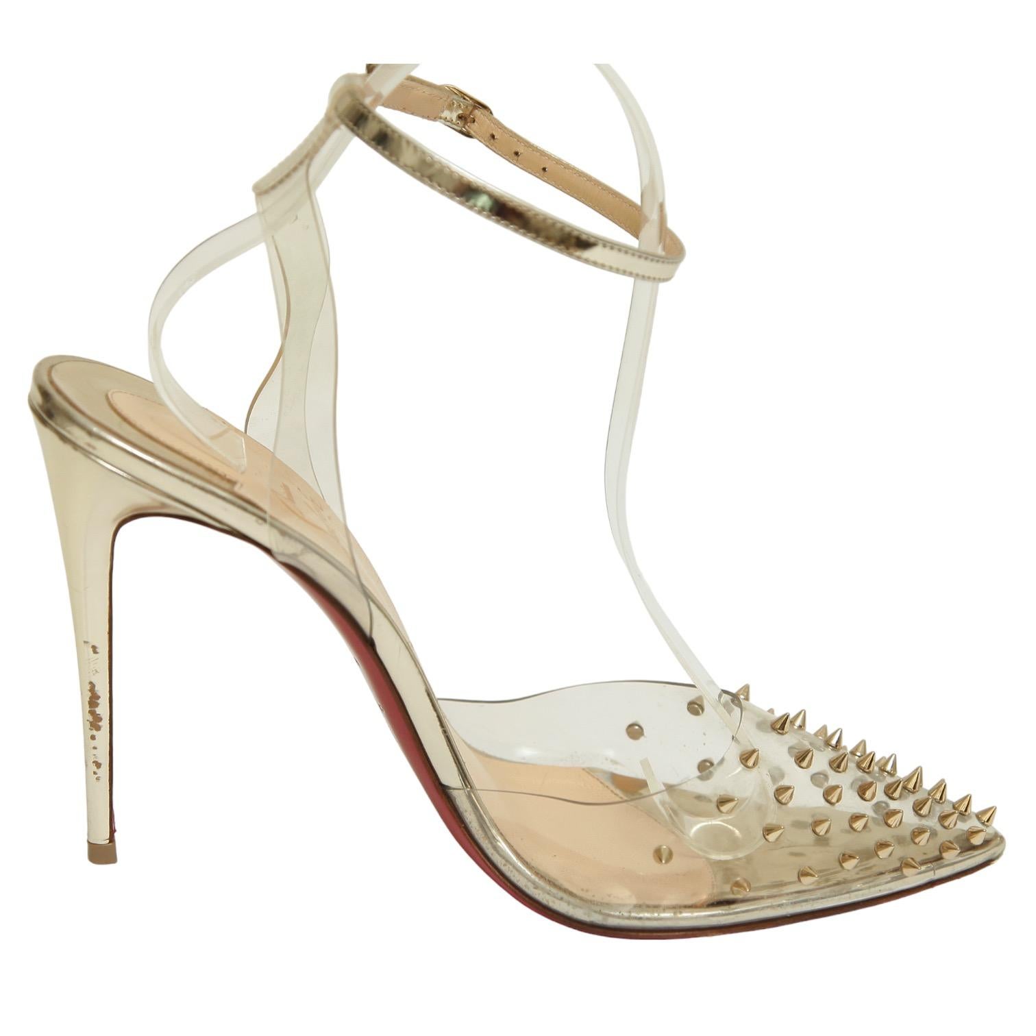 CHRISTIAN LOUBOUTIN SPIKOO METALLIC GOLD SPIKED & PVC PUMPS

Retail excluding sales taxes $995.

Details:
- PVC upper with gold metallic spikes.
- Pointed toe.
- Ankle strap with buckle closure.
- Self covered heels.
- Leather lining and sole.
-