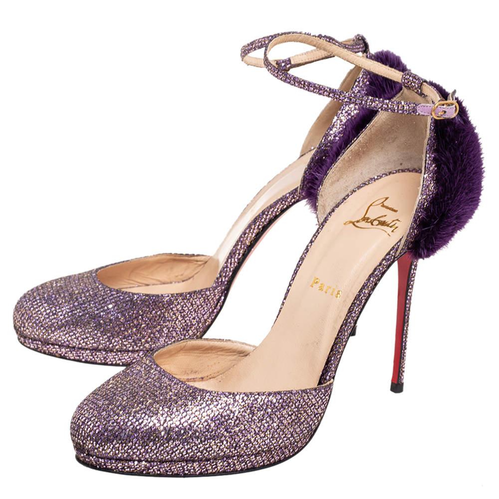 Crafted using lush glitter fabric and mink fur, these D'orsay pumps from the house of Christian Louboutin add glamour to your feet. The purple pair flaunts stunning high heels and buckle closures. Add the fantastic creation to your closet and rock