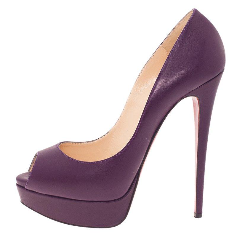These Christian Louboutin pumps are a classic pair of shoes for any lady. They feature purple leather uppers, peep toe, self covered platforms, and 15.5 cm high heels. These pumps are lined with beige leather and have Christian Louboutin labeled