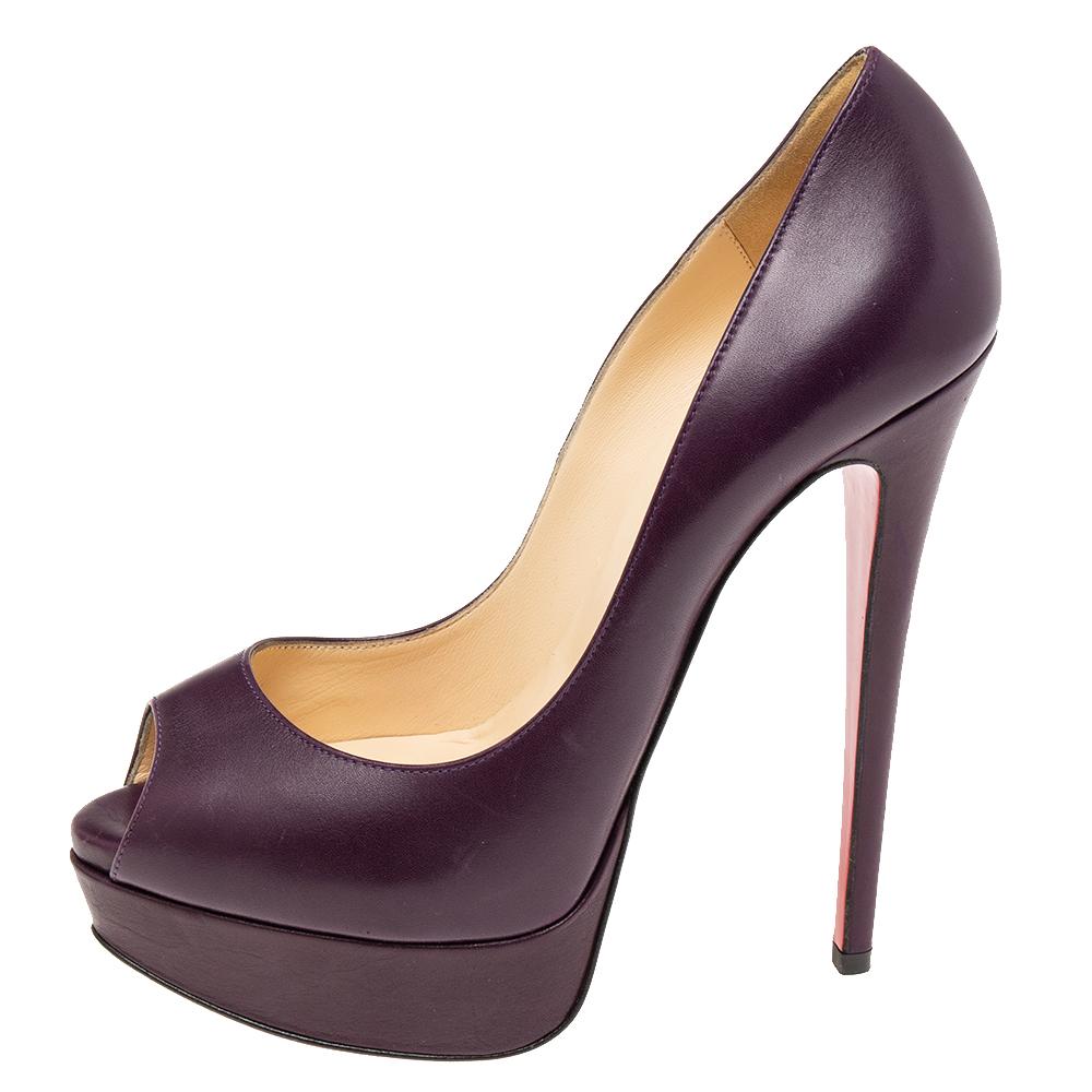 Stand out from the crowd with this gorgeous pair of Louboutins that exude high fashion with class! Crafted from leather, this is a creation from their Lady Peep collection. They feature a purple shade with peep toes and a smooth exterior. Completed