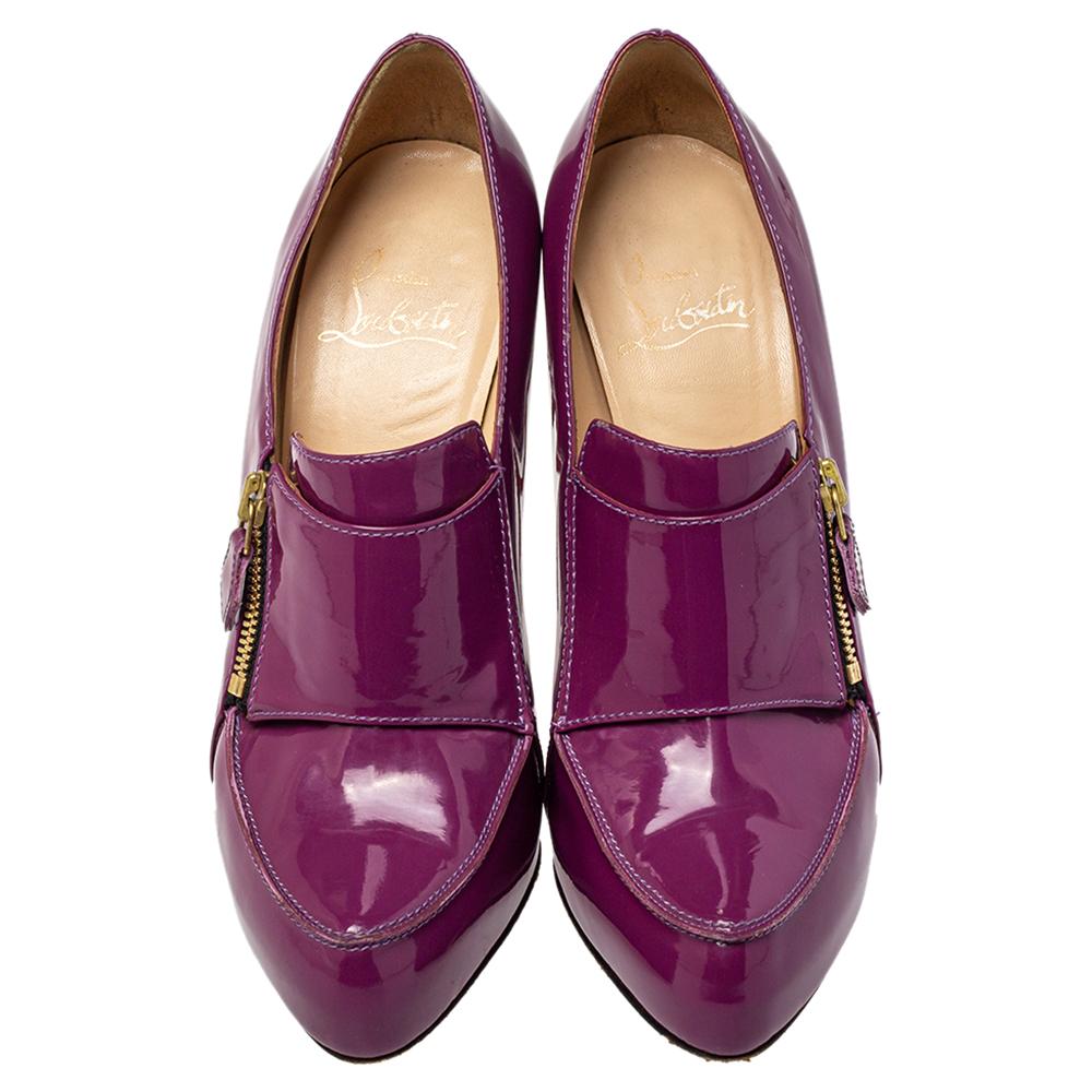 Christian Louboutin delivers simple elegance for the contemporary woman with these gorgeous loafer pumps perfect for office and off-duty events. Made from patent leather, the vamps are detailed with zippers in gold-tone metal. The overall look is