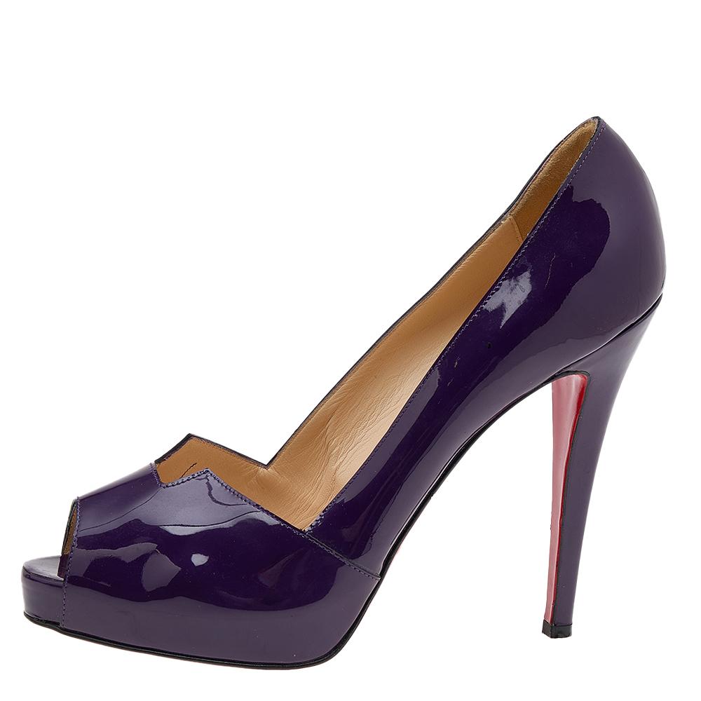 Stand out from the crowd with this gorgeous pair of Louboutins that exude high fashion with class! Crafted from patent leather, they feature a mesmerizing purple shade with peep toes and a glossy exterior. Completed with leather insoles, towering
