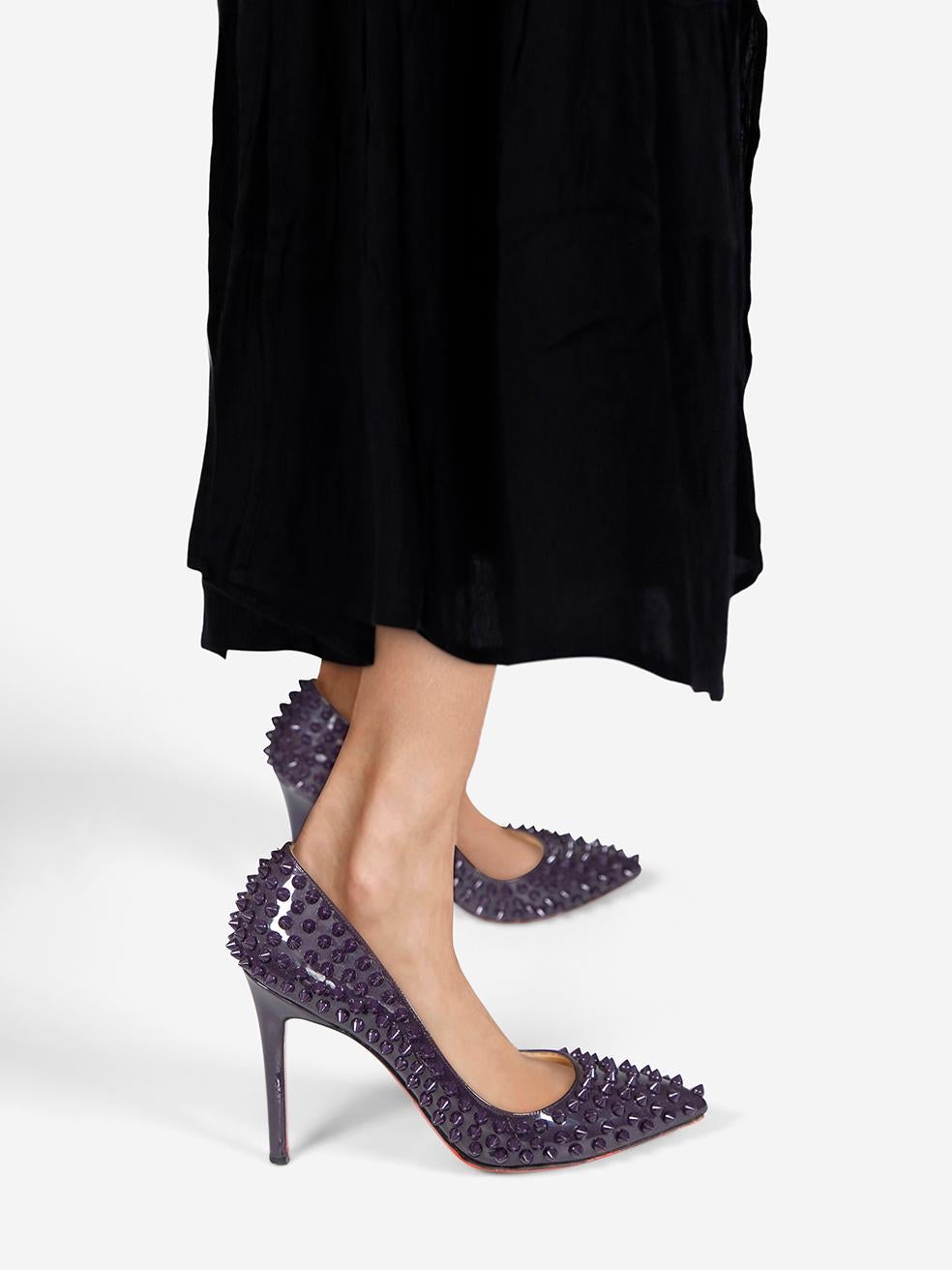 CONDITION is Very good. Minimal wear to the heels is evident. Abrasion on the heel and toe box on both shoes. Missing stud on the left side of the left shoe and right counter on this used Christian Louboutin designer resale item. This pair of shoes