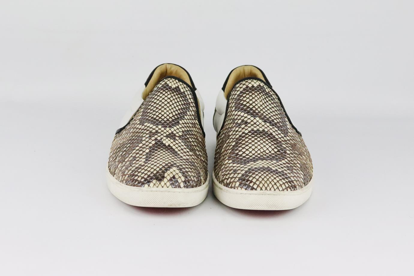 Christian Louboutin python and leather slip on snakers. Made from taupe and ecru python with white, gold and black leather in a classic slip-on sneaker style on the brand’s iconic red sole. Black, white, gold and taupe. Slip on. Does not come with
