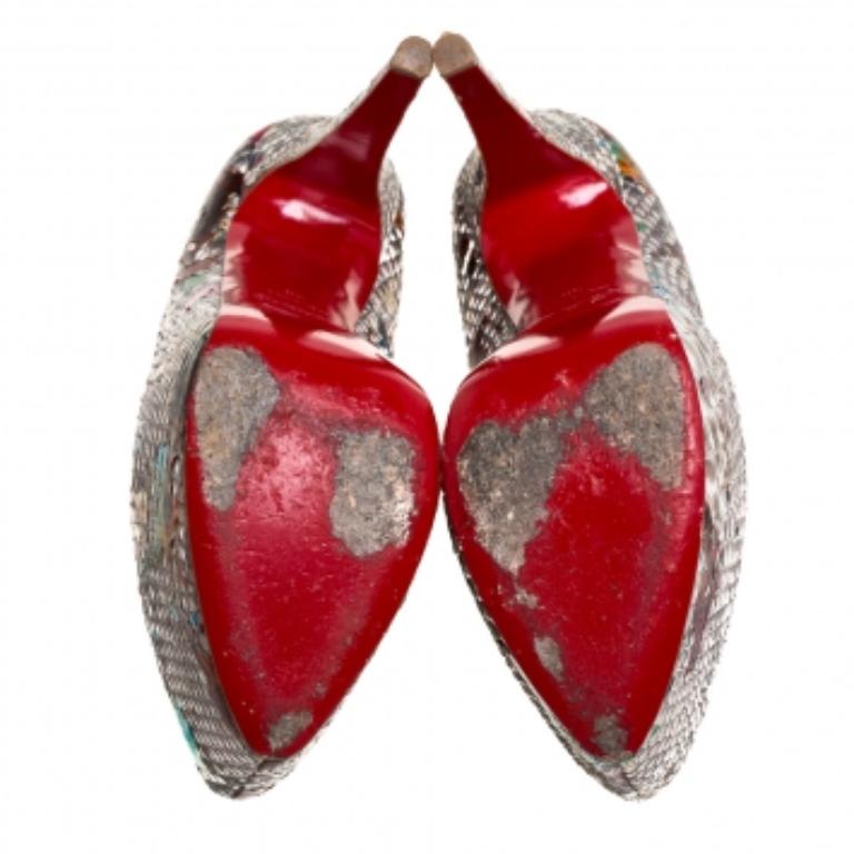 Take your love for Louboutins to new heights by adding this gorgeous pair to your collection. The pumps simply speak high fashion in every stitch and curve. The exteriors come made from python leather and the pumps are finished with platforms, 15.5
