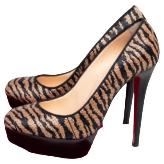 A classic to add to one's shoe collection is this pair. These Christian Louboutin beauties are covered in raffia and styled with platforms, 13 cm heels, and the signature red soles. Add these pumps to your closet today and flaunt them with pride.
