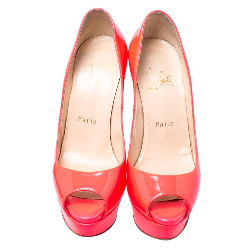 Stand out from a crowd with this gorgeous pair of Louboutins that exude high fashion with class! Crafted from patent leather, this is a creation from their Lady Peep collection. They feature a bright fluorescent red shade with peep-toes and a glossy