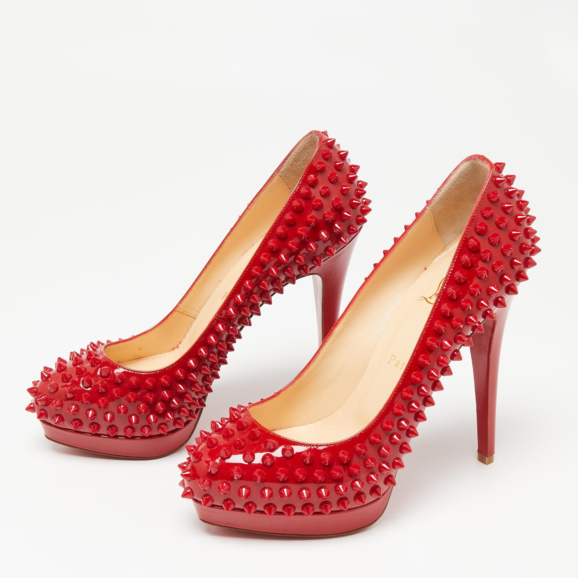 Make a dazzling statement in these Louboutins! Crafted from patent leather, these red CL pumps have covered toes, spike embellishments, and 13 cm heels. Complete with the signature red soles, this pair embodies the fine art of shoemaking.

Includes: