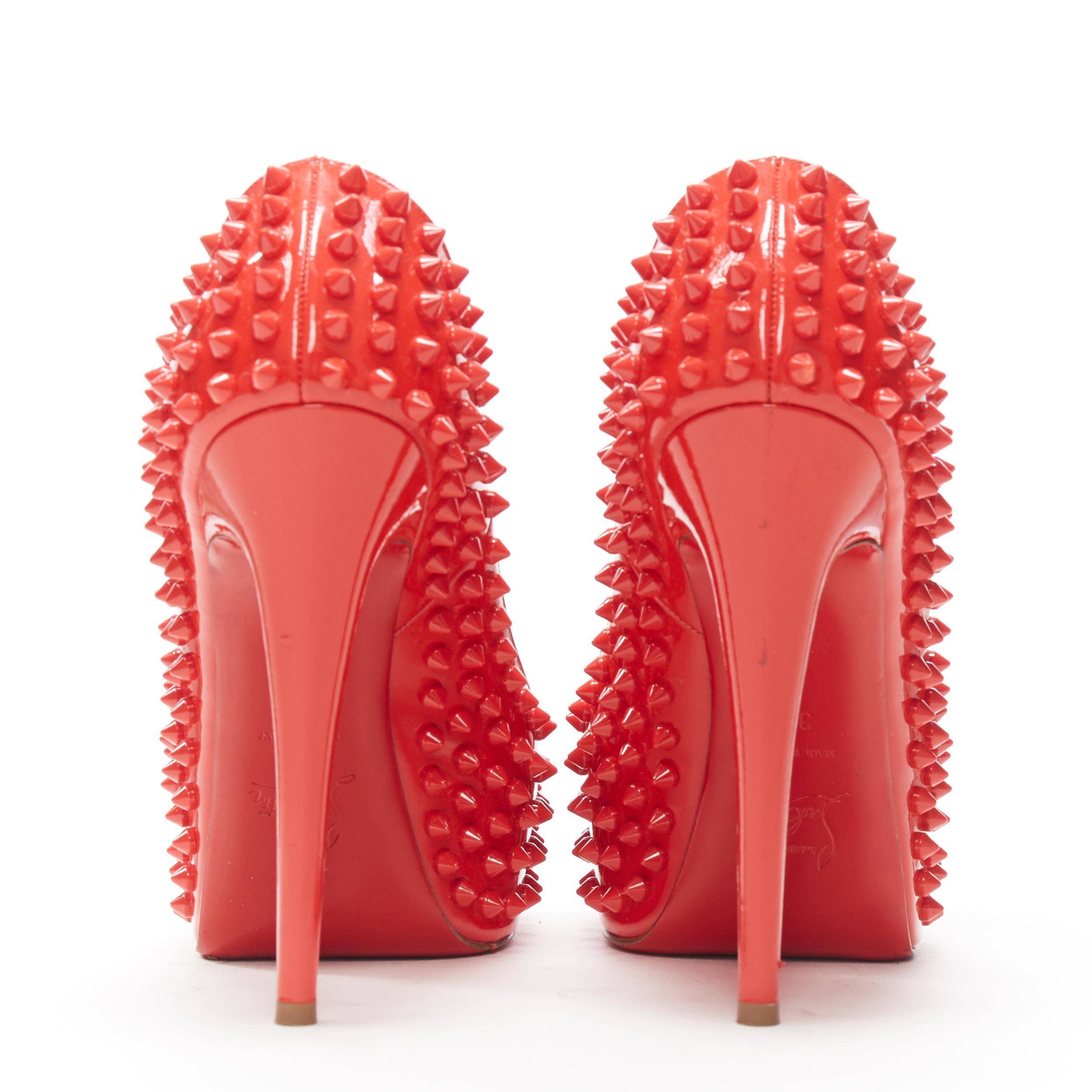 CHRISTIAN LOUBOUTIN red patent spike stud peep toe platform high heel pump EU39 Reference: TGAS/A03533 
Brand: Christian Louboutin 
Designer: Christian Louboutin 
Material: Patent leather 
Color: Red 
Pattern: Solid 
Closure: Slip on 
Extra Detail: