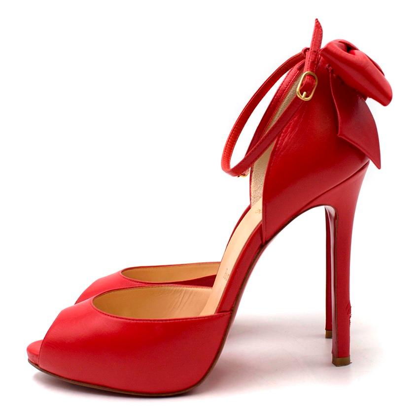 Christian Louboutin Red Peep-toe Bow Detail Pumps

- Peep-toe
- High stiletto heel
- Smooth, soft red leather
- Matching red leather bow detail at the back
- Ankle strap with buckle fastening
- Gold-tone hardware
- Signature red sole

Please note,