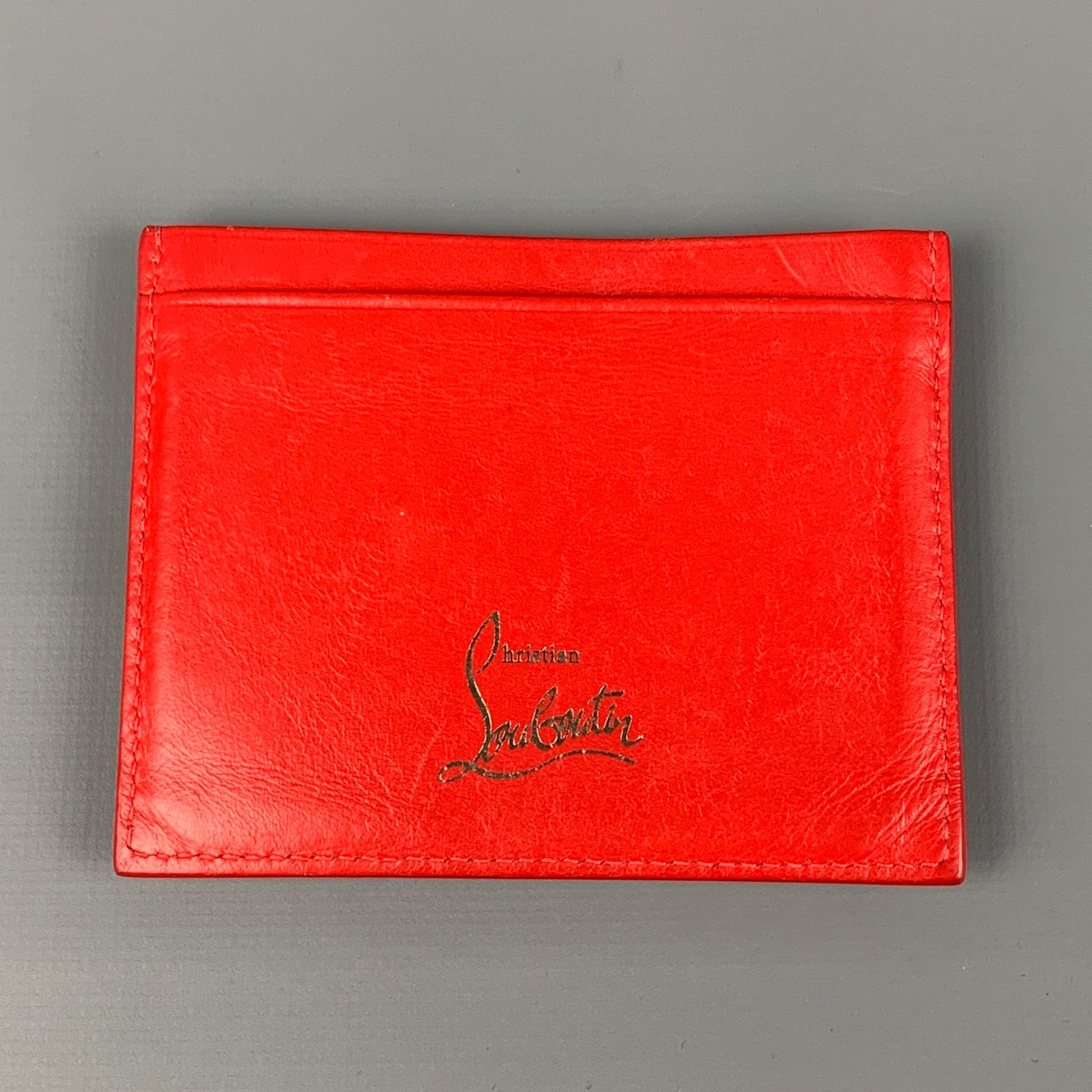 CHRISTIAN LOUBOUTIN card holder comes in a red leather featuring card slots and a studded design. Made in Italy.
 Very Good
 Pre-Owned Condition. 
 

 Measurements: 
  
 3.75 inches x 3 inches 
  
  
  
 Sui Generis Reference: 118860
 Category: