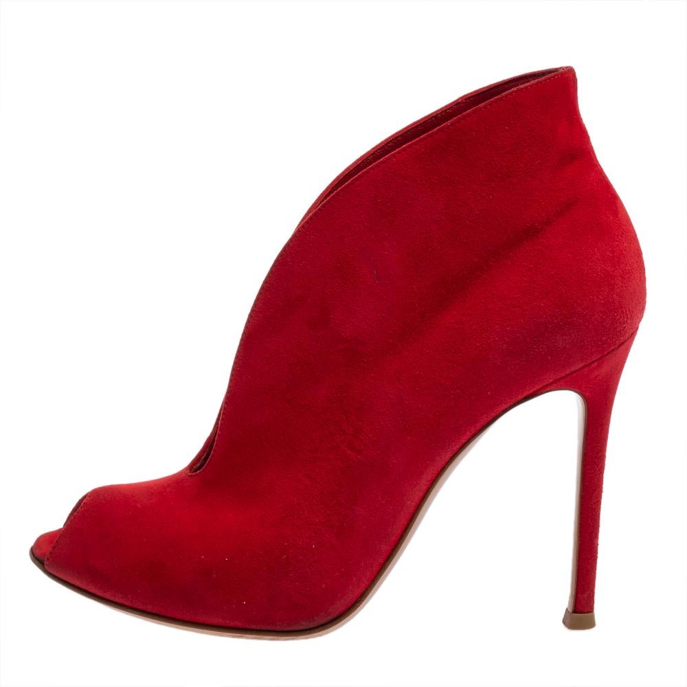 These fabulous Chester Fille booties from Christian Louboutin are chic and worth admiring! They have been crafted from red suede and styled with peep-toes and curved open vamps. They come equipped with comfortable leather-lined insoles and stand