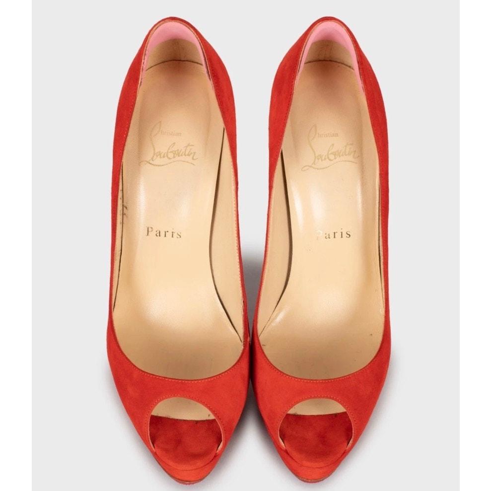 Step out in style with these stunning Christian Louboutin red suede peep-toe pumps! In very good condition, these heels are sure to turn heads. 

Size: 38.5 (true to size)

Material: Suede upper, Leather insole

Color: Red

Heel Height: 5.3