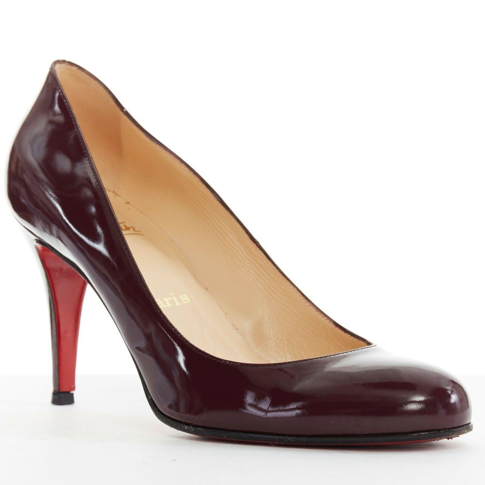CHRISTIAN LOUBOUTIN Ron Ron 85 purple patent leather round toe pumps heel EU39.5
CHRISTIAN LOUBOUTIN
Ron Ron 85. dark purple leather upper. 
Round toe. Covered heel. Padded insole. 
Tan leather lining. Signature red lacquered sole. 
Made in
