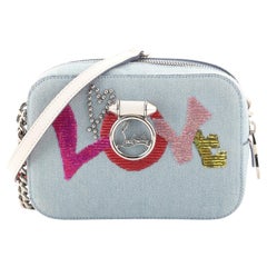 Christian Louboutin - Sac à bandoulière rubis Love Crossbody Mini en denim