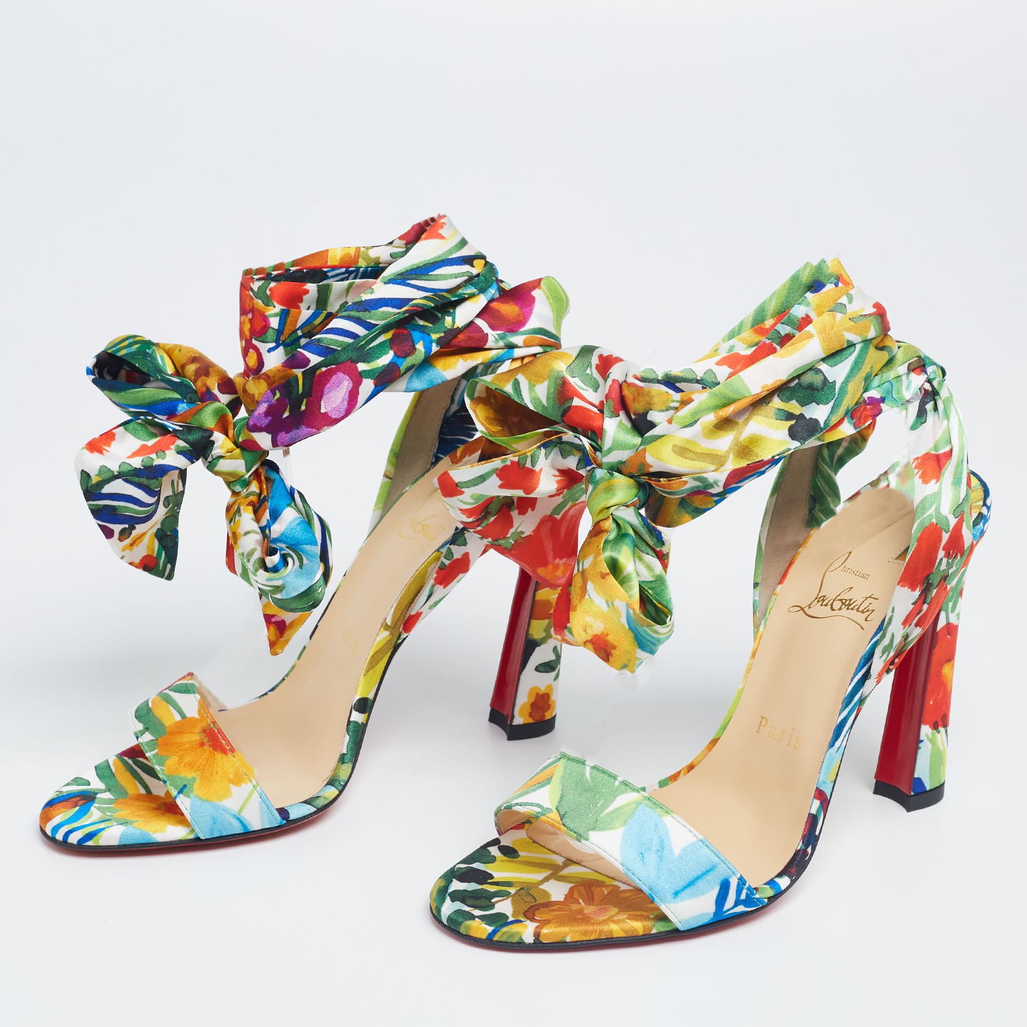 Sophistication and never-aging glamour are personified in these Christian Louboutin sandals. They have a printed satin construction with open toes and scarf ankle ties, all mounted on 10.5 cm heels.

Includes: Original Dustbag, Original Box