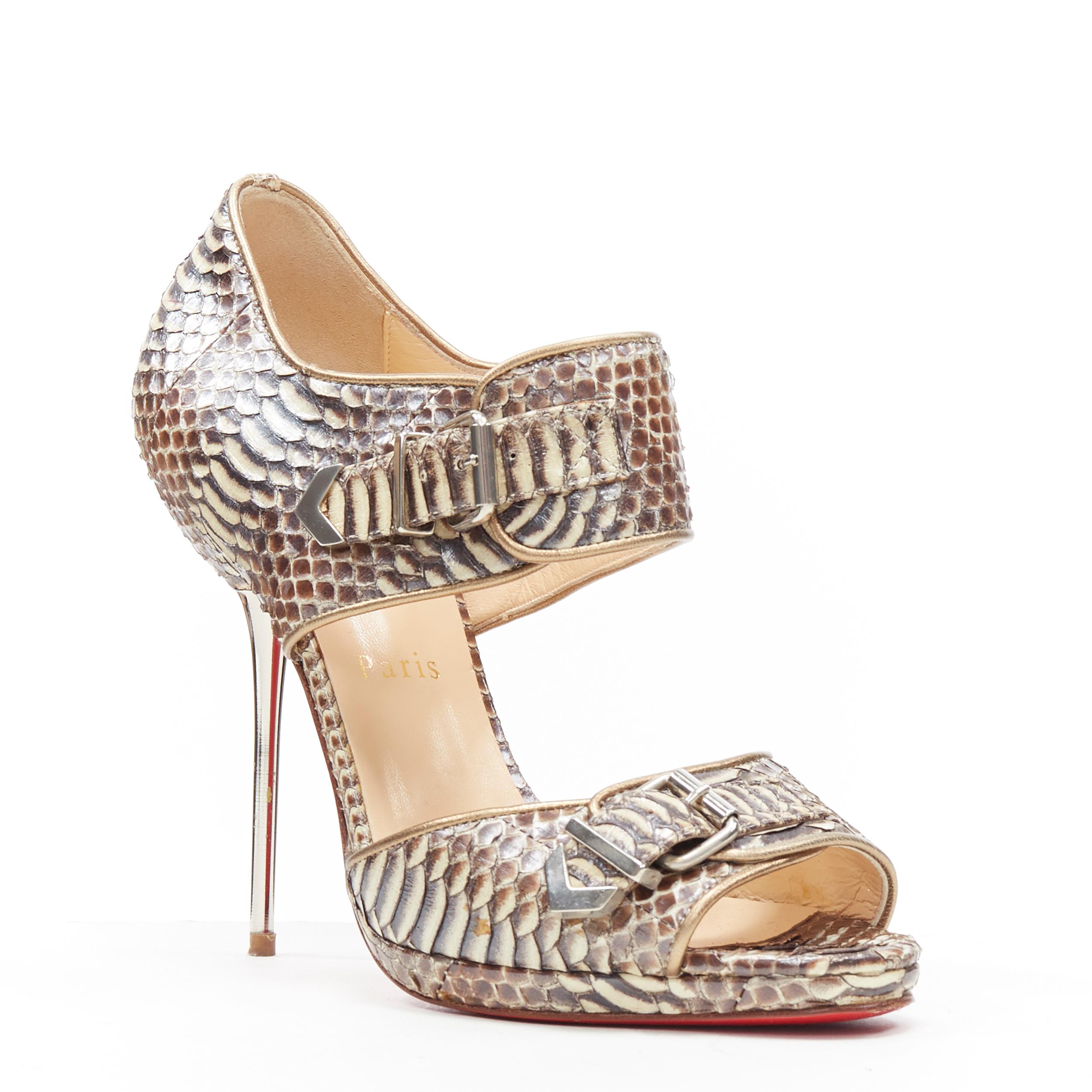 CHRISTIAN LOUBOUTIN scaled leather buckle strap metal pin heel sandals EU37
Brand: Christian Louboutin
Designer: Christian Louboutin
Model Name / Style: Pin heel sandals
Material: Leather
Color: Beige
Pattern: Snakeskin
Closure: Ankle strap
Extra
