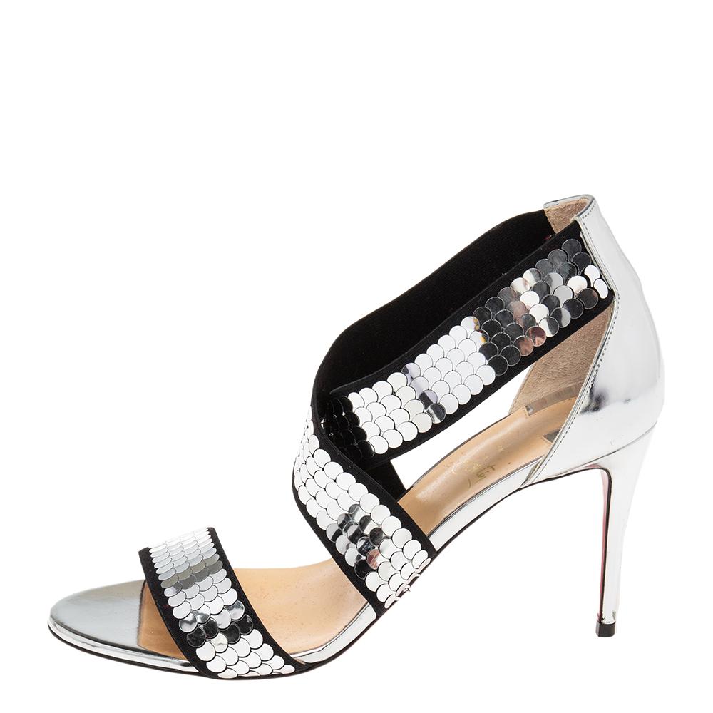 The silver sequins on the criss-cross and wide strap make these Christian Louboutin Xili sandals an ideal party accessory. Set on 8.5cm heels, the open-toe pair shows the brand's expertise in creating noteworthy and classic designs. The signature