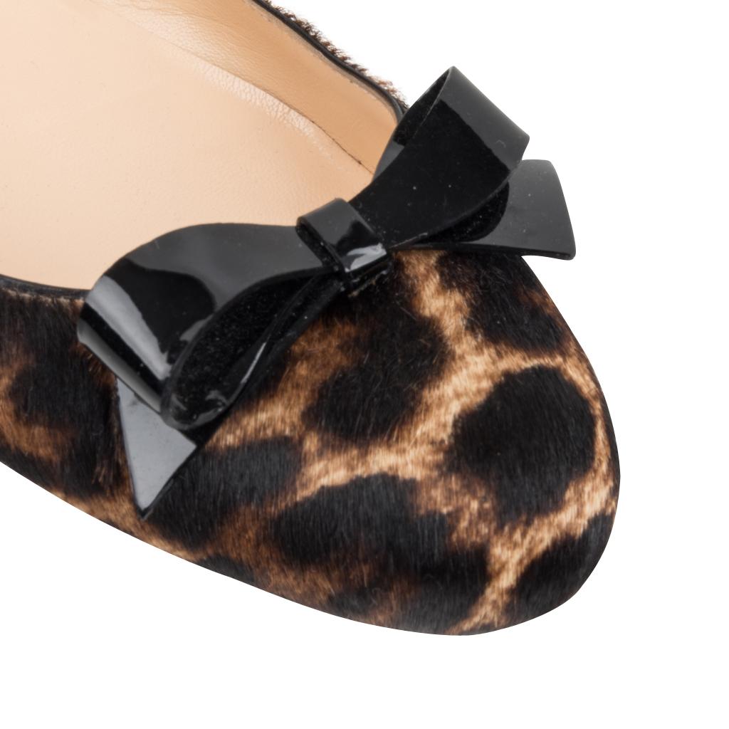 Guaranteed authentic Christian Louboutin ballet flat leopard print calf hair. 
Patent leather bow over toe.
Edged in very thin black leather.                      
final sale

SIZE  39
USA SIZE  9
    
SHOE  MEASURES:
HEEL  1/8