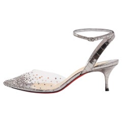 Christian Louboutin Silver, cinturino alla caviglia in pelle e PVC Spikaqueen, in argento e goffrato.