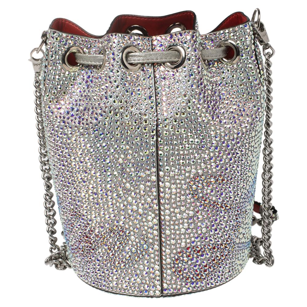 Christian Louboutin gives its Marie Jane bucket bag a dazzling update. This version is made from leather and adorned with scores of shimmering crystals throughout the exterior. It has a sturdy base and an optional chain strap.

Includes: Info Booklet