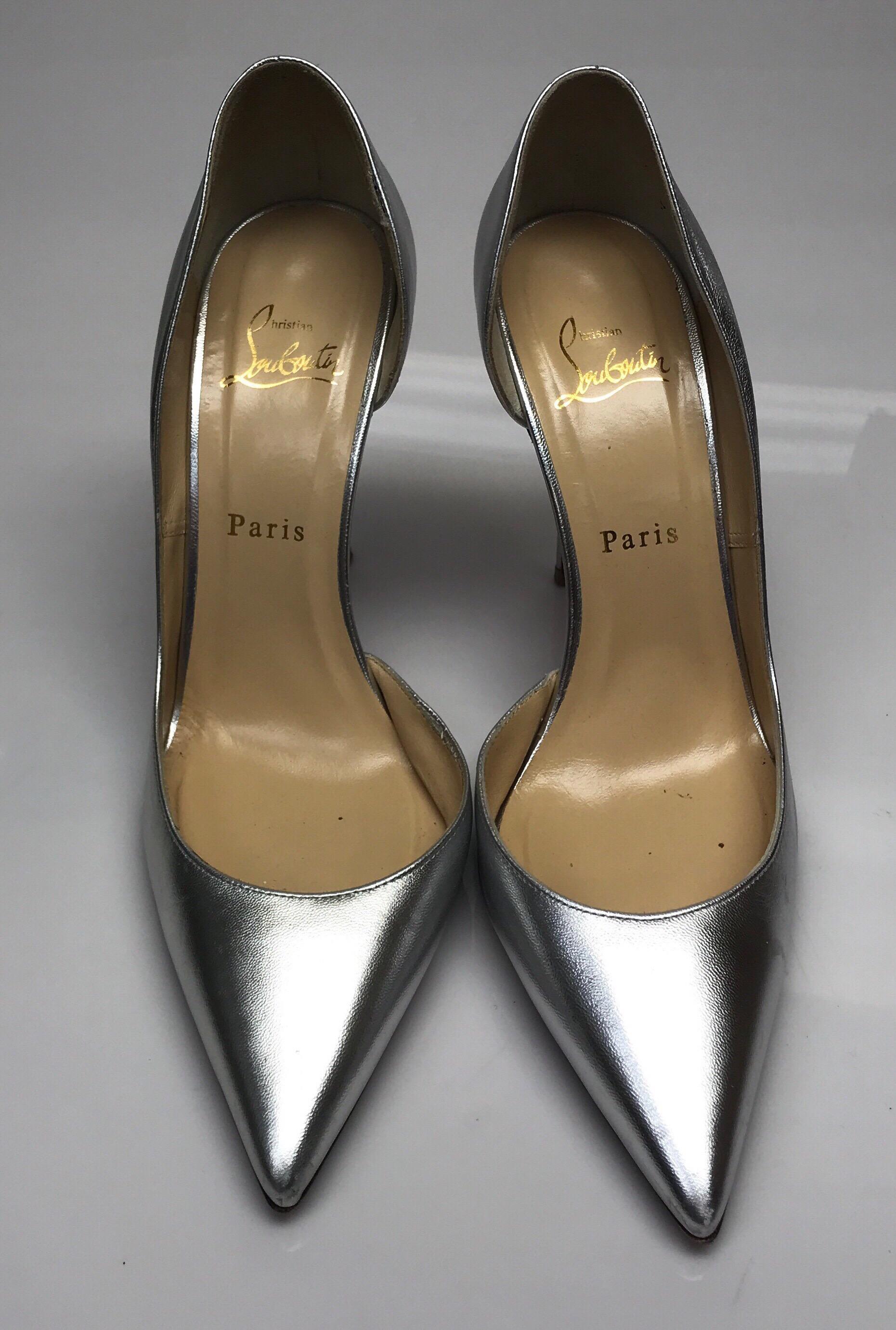 CHRISTIAN LOUBOUTIN Silver D'orsay Shoes-39.5. These amazing Christian Louboutin heels are in great condition. They show wear consistent with use. The red bottoms have slightly rubbed away and the leather has very small smudges in it. These shoes