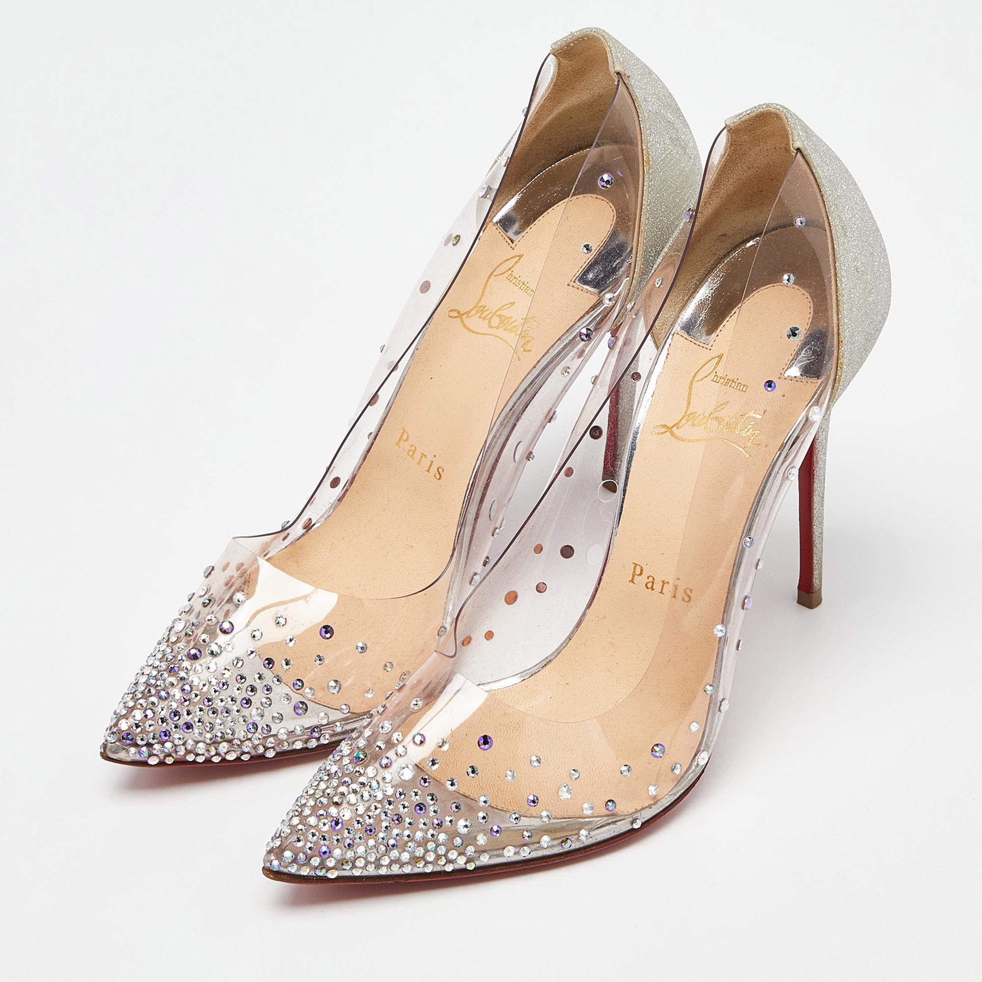Be ready for glamor when you walk in these pumps from Christian Louboutin. Crafted from clear PVC, they have crystals and glitter too. The pair is complete with 11 cm heels and the iconic red soles.