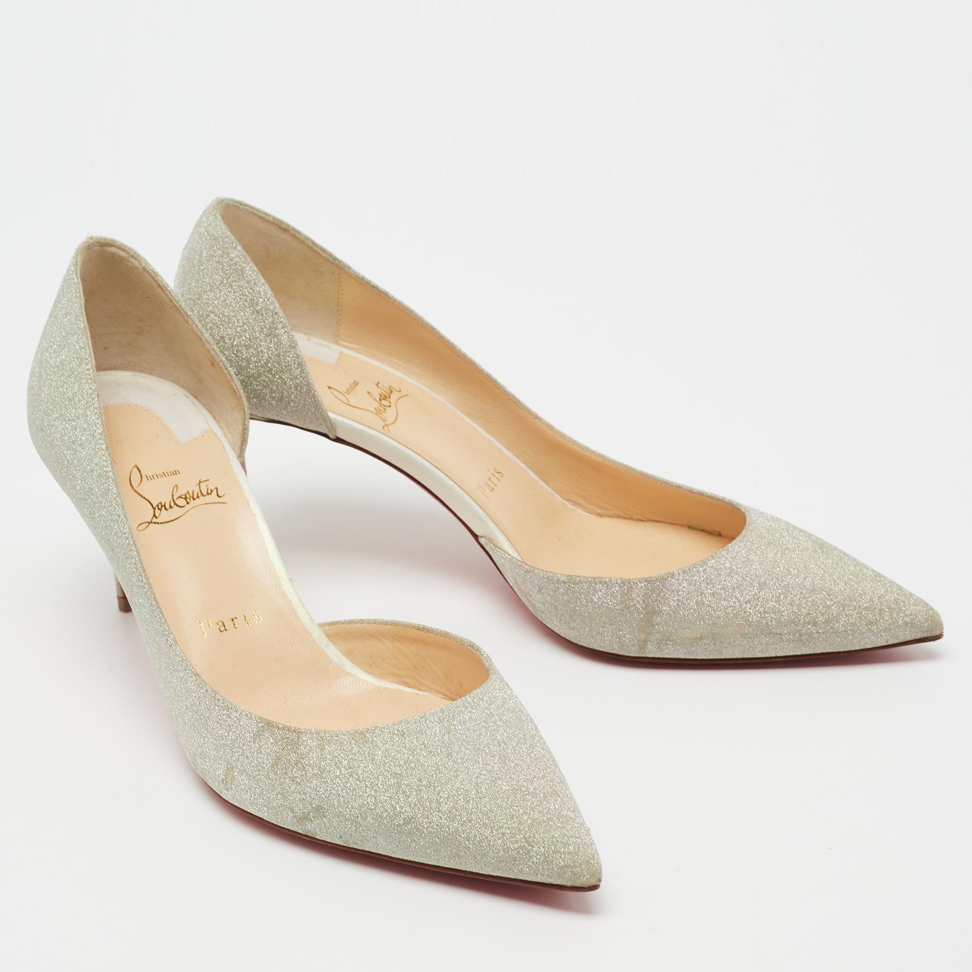 Skilfully crafted from glitter in a D'orsay style with pointed toes, these Christian Louboutin pumps come ready to give you a high-fashion experience. The silver pumps, with sharp-cut toplines, are balanced on 7 cm heels and finished with