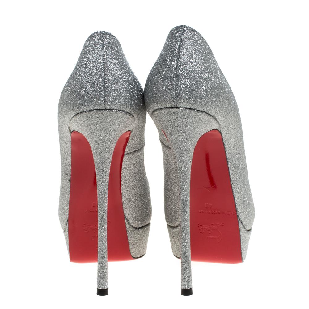 Stand out from a crowd with this gorgeous pair of Louboutins that exude high fashion with class! Crafted from glitter, this is a creation from their Lady Peep collection. They feature a lovely silver shade with peep toes and a shimmering exterior.