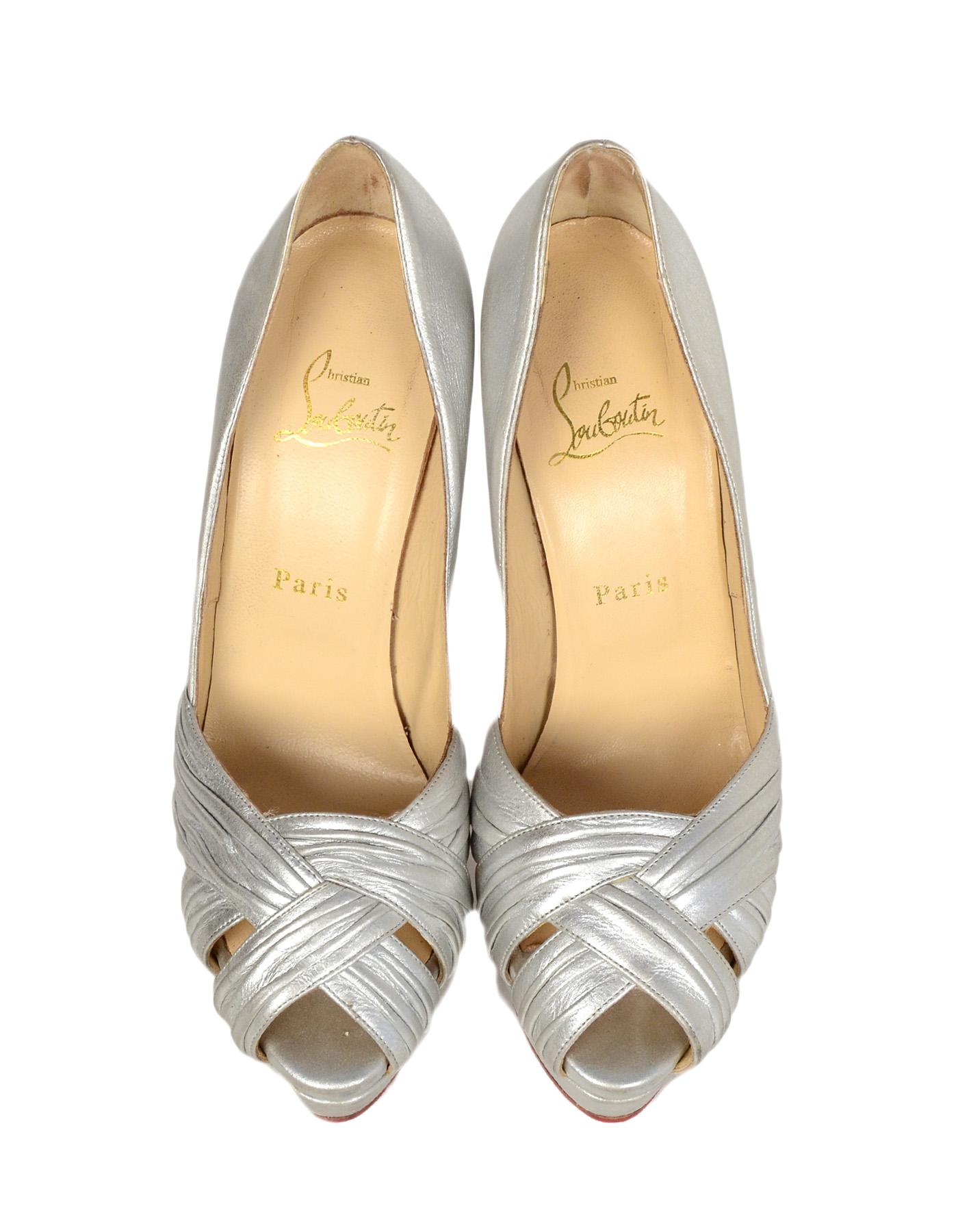 Christian Louboutin Silver Leather Aborina 150 Platform Peep Toe Pumps sz 39

Made In: Italy
Color: Metallic Silver
Hardware: None
Materials: Leather
Closure/Opening: Slide on
Overall Condition: Good pre-owned condition.  Wear throughout leather,