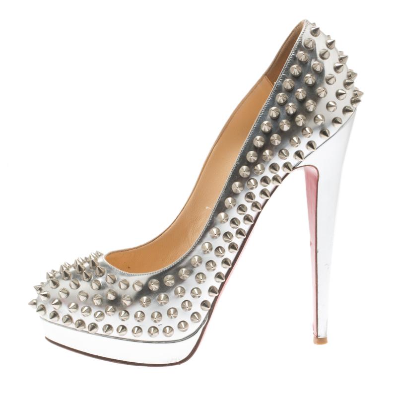 Complete your look with this stunning pair of platform pumps from Christian Louboutin. Crafted from leather, they feature impressive spike adornment and profiles leather insoles along with brand labeling. They are elevated on 15 cm tall heels and