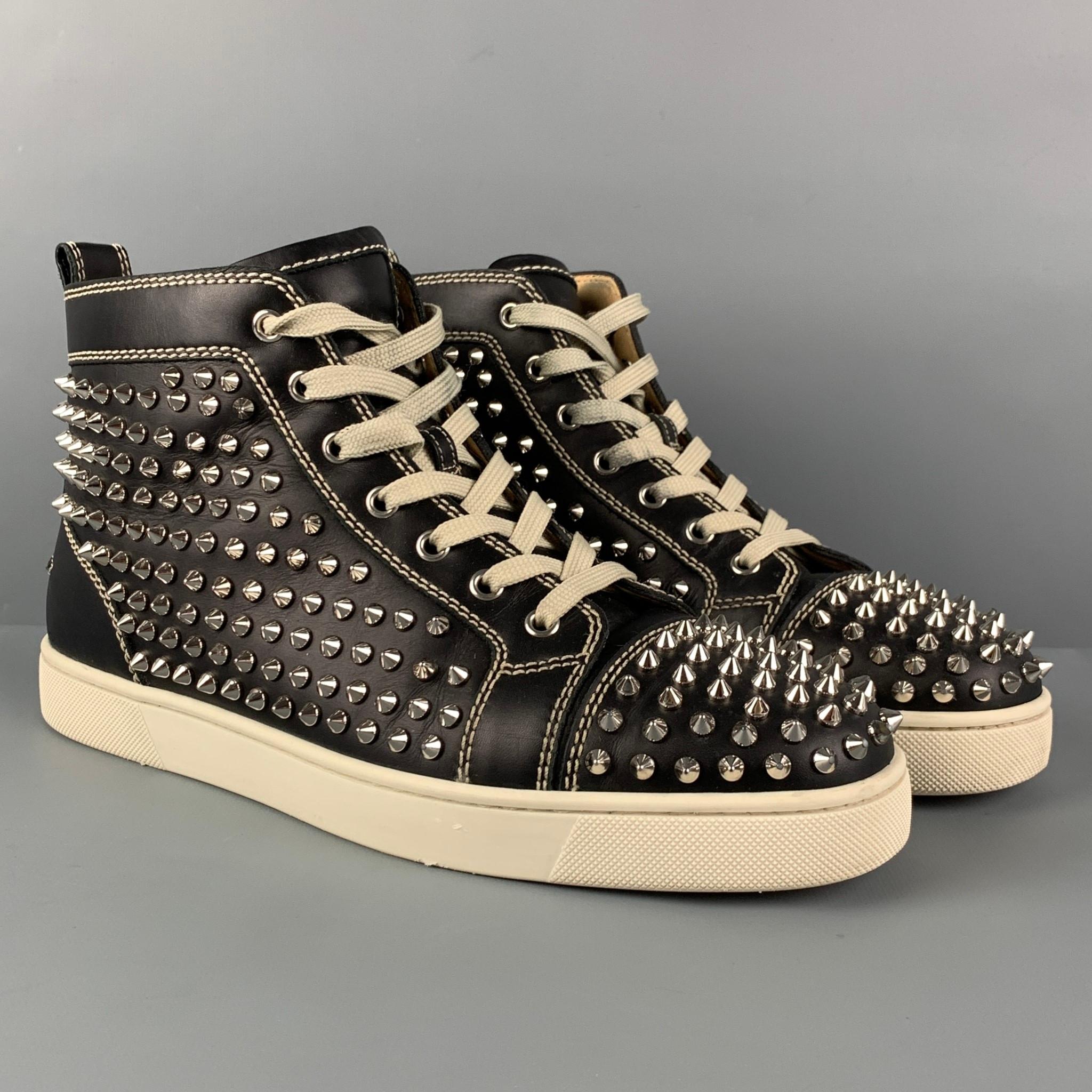 CHRISTIAN LOUBOUTIN 'Louis All Over Spikes High Top' sneakers comes in a black leather featuring silver tone spike details throughout, high-top, signature red sole, and a lace up closure. Comes with dust bag. 

Very Good Pre-Owned Condition. Altered