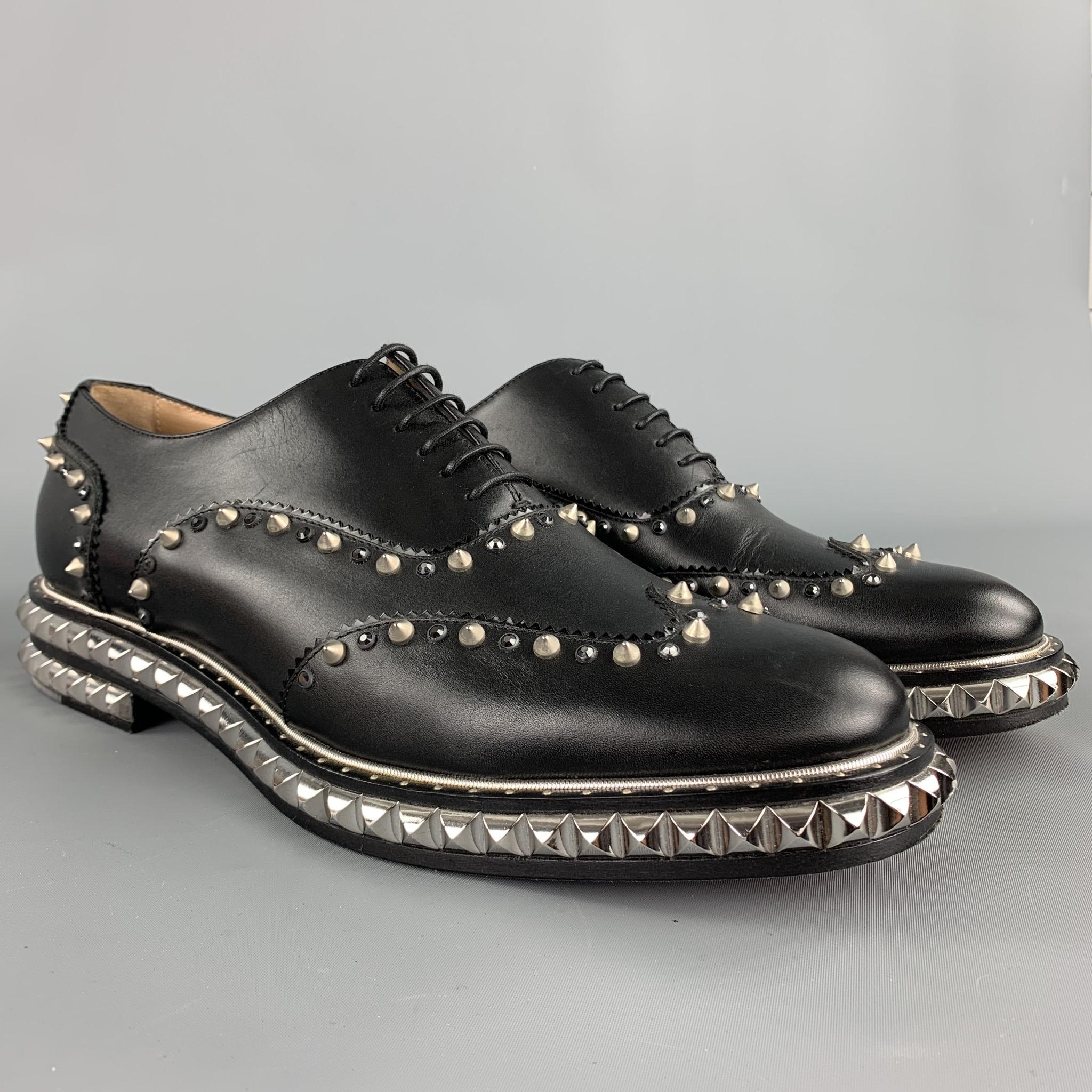 CHRISTIAN LOUBOUTIN lace up shoes comes in a black leather with a studded detail design featuring a wingtip style and a wooden sole. Comes with box. Made in Italy.

Excellent Pre-Owned Condition.
Marked: EU 43.5

Outsole: 

12.5 in. x 4 in. 