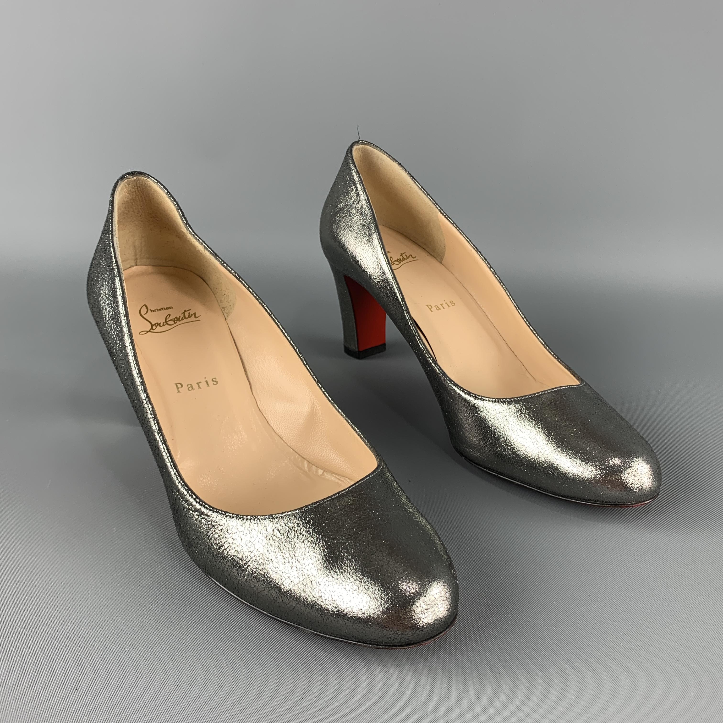 CHRISTIAN LOUBOUTIN Pumps comes in a silver tone in a metallic leather material, with a chunky heel. Made in Italy.
 
Excellent Pre-Owned Condition.
Marked: IT 41
 
Heel: 3 in.