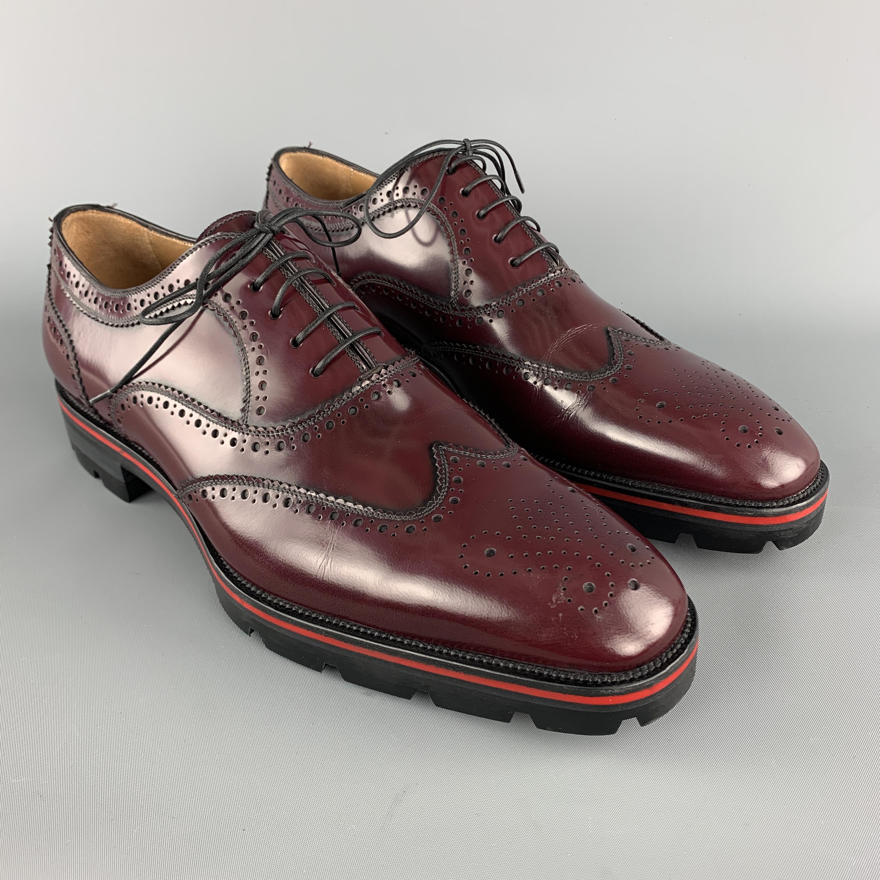 CHRISTIAN LOUBOUTIN oxford lace up shoes comes in burgundy tones in leather material, featuring an antique style, a wingtip, a branded leather insole and a rubber red outsole.  Made in Italy.

Excellent Pre-Owned Condition. 
Marked: EU 45

Outsole: