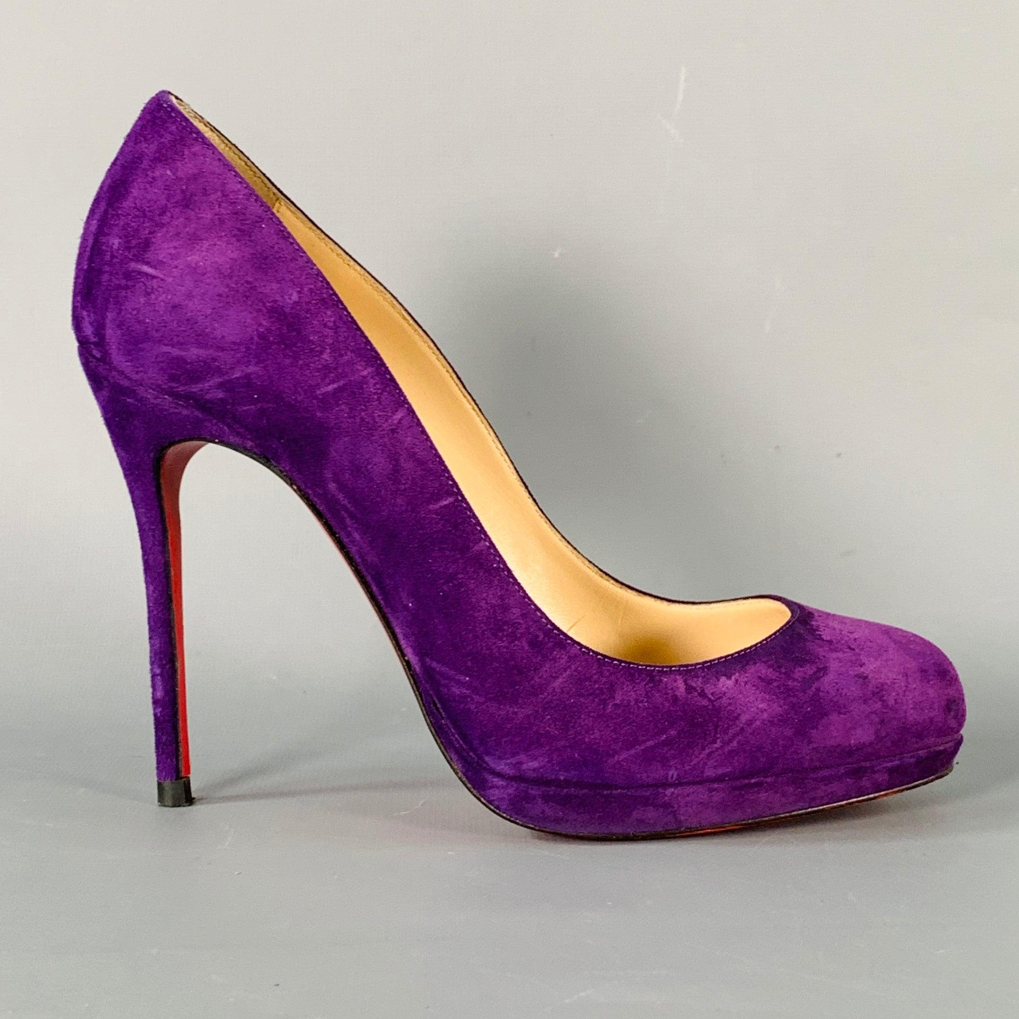 CHRISTIAN LOUBOUTIN platform pumps in a purple suede featuring a stiletto heel, and slip on closure. Note: these soles have been professionally repainted in order to retain the integrity of the design. Made in Italy.Very Good Pre-Owned Condition.