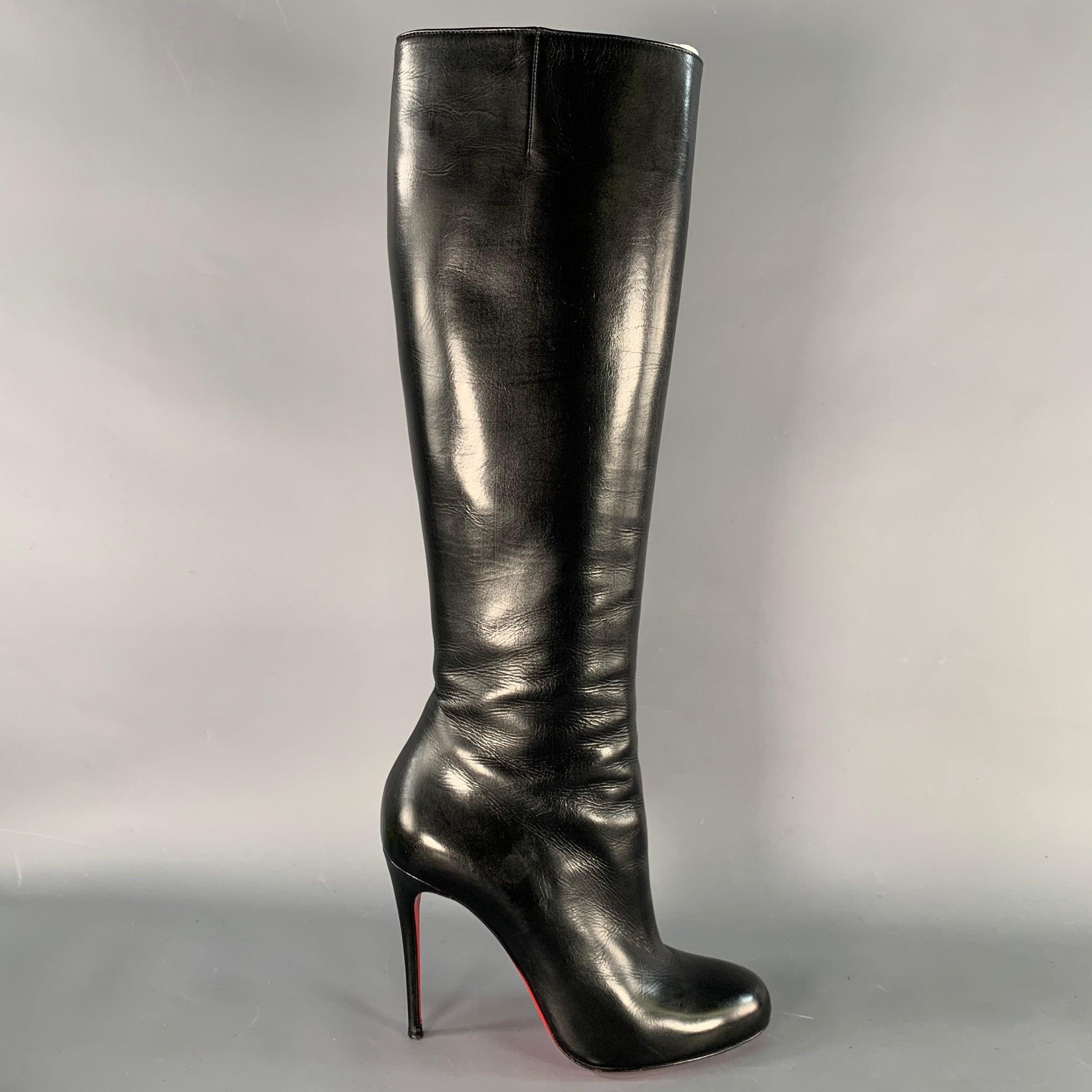 CHRISTIAN LOUBOUTIN boots
in a black leather featuring a knee high style, stiletto heel, and side zipper closure. Comes with dust bag. Note: these soles have been professionally repainted in order to retain the integrity of the design. Made in