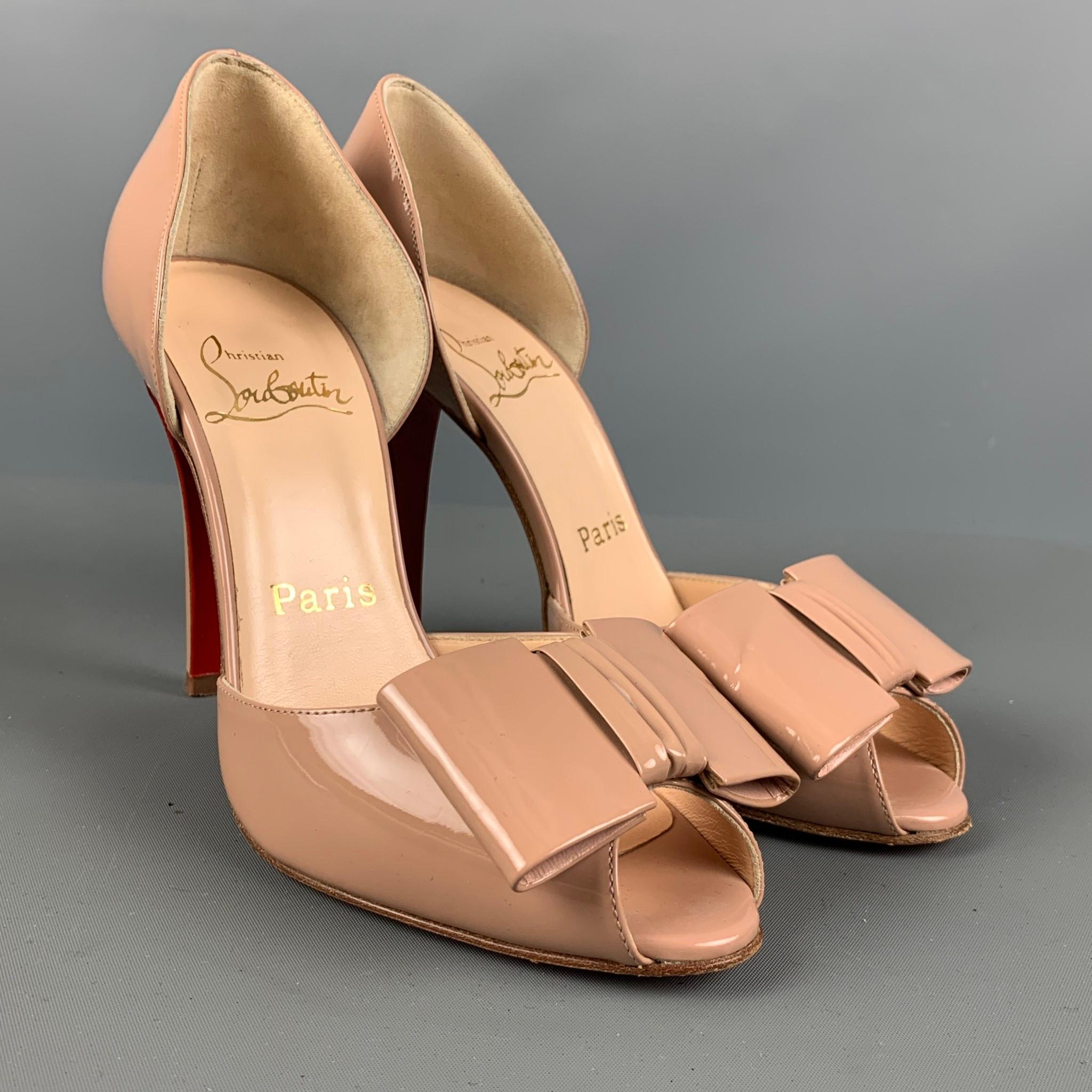 CHRISTIAN LOUBOUTIN pumps comes in a beige patent leather featuring an open toe, signature red sole, bow detail, and a stiletto heel. Made in Italy.

Very Good Pre-Owned Condition.
Marked: 36

Measurements:

Heel: 4.5 in.

 

SKU: 124368
Category: