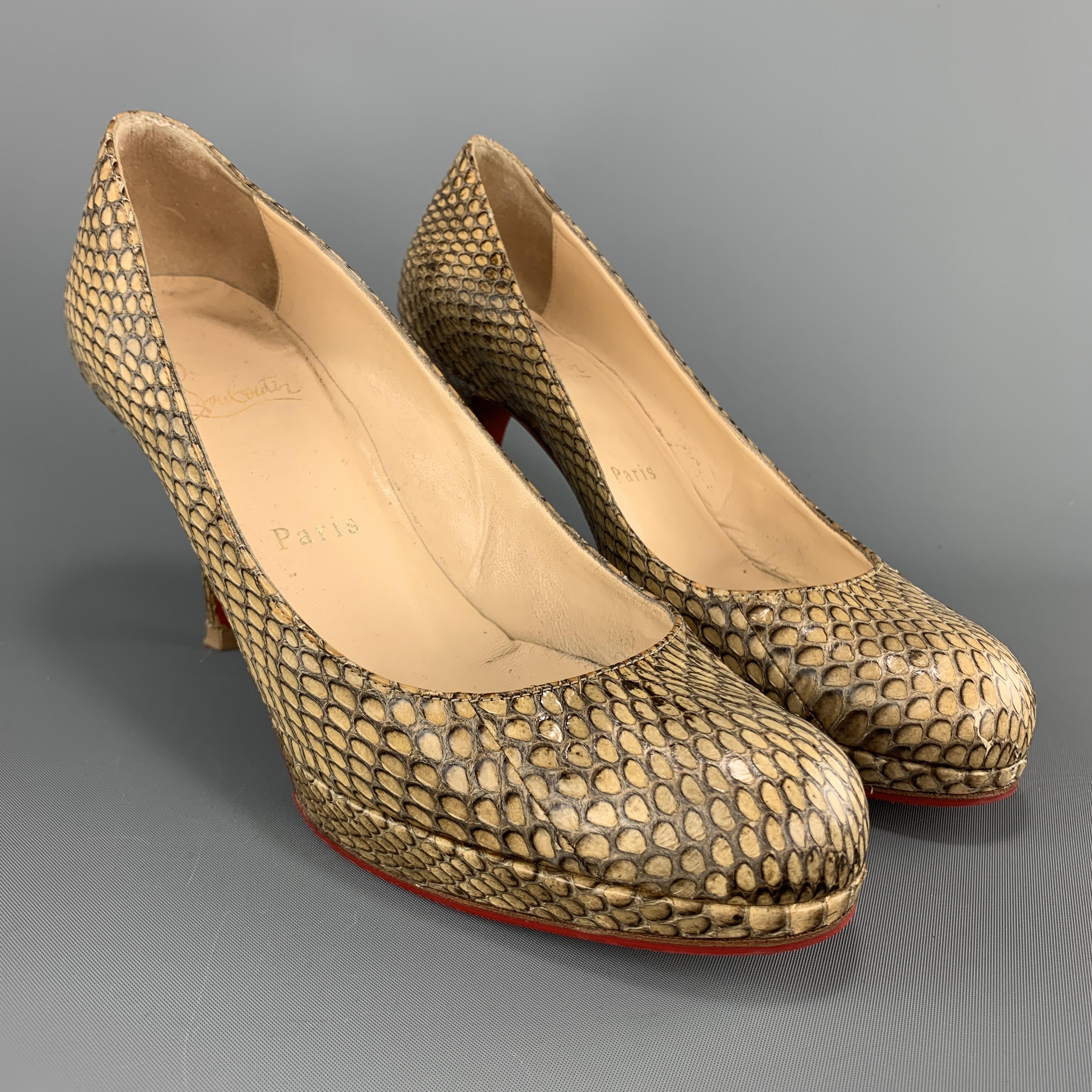 CHRISTIAN LOUBOUTIN pumps come in snakeskin with platform and covered heel. Made in Italy.

Very Good Pre-Owned Condition.
Marked: IT 36.5 

Measurements:

Heel: 3.5 in.
Platform: 0.5 in.