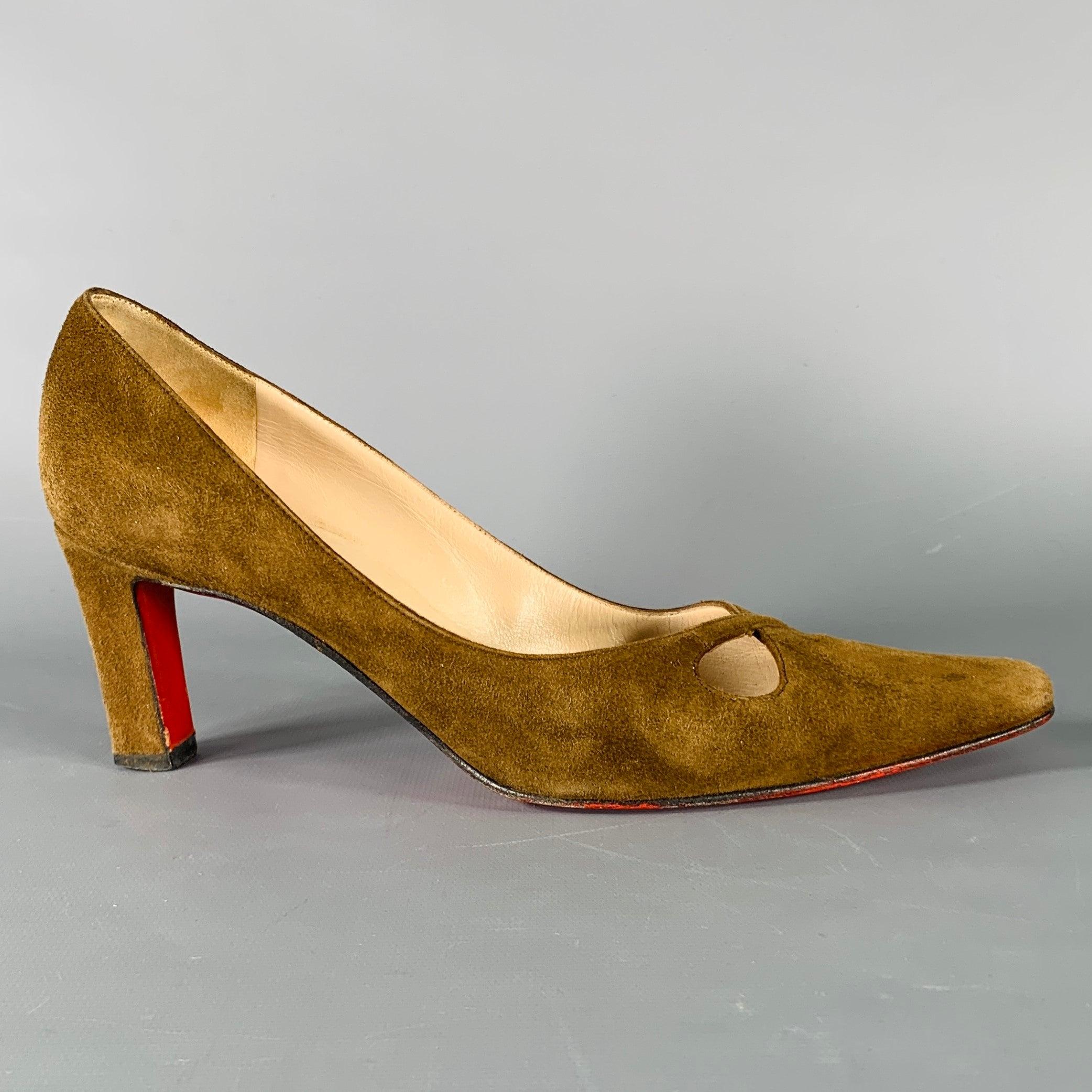 Vintage CHRISTIAN LOUBOUTIN pumps in a brown suede fabric featuring a classic style, keyhole detail, and slip on closure. Made in Italy. Note: the soles have been repainted due to vintage condition.Very Good Pre-Owned Condition. Moderate signs of