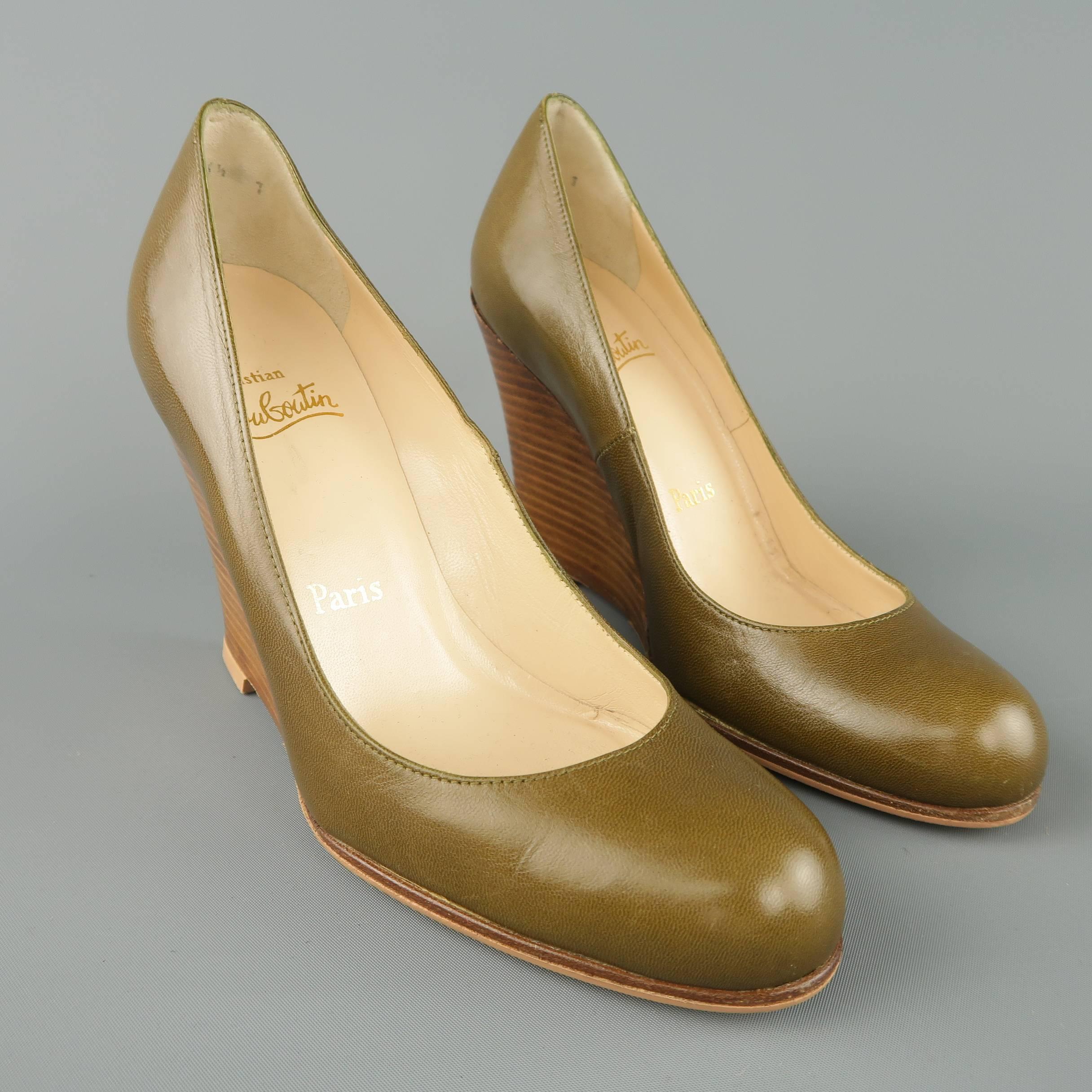 Christian Louboutin pumps come in olive green leather with a tan stacked leather wedge heel. Made in Italy.
 
Good Pre-Owned Condition.
Marked: IT 36.5
 
Measurements:
 
Heel: 3.75 in.
