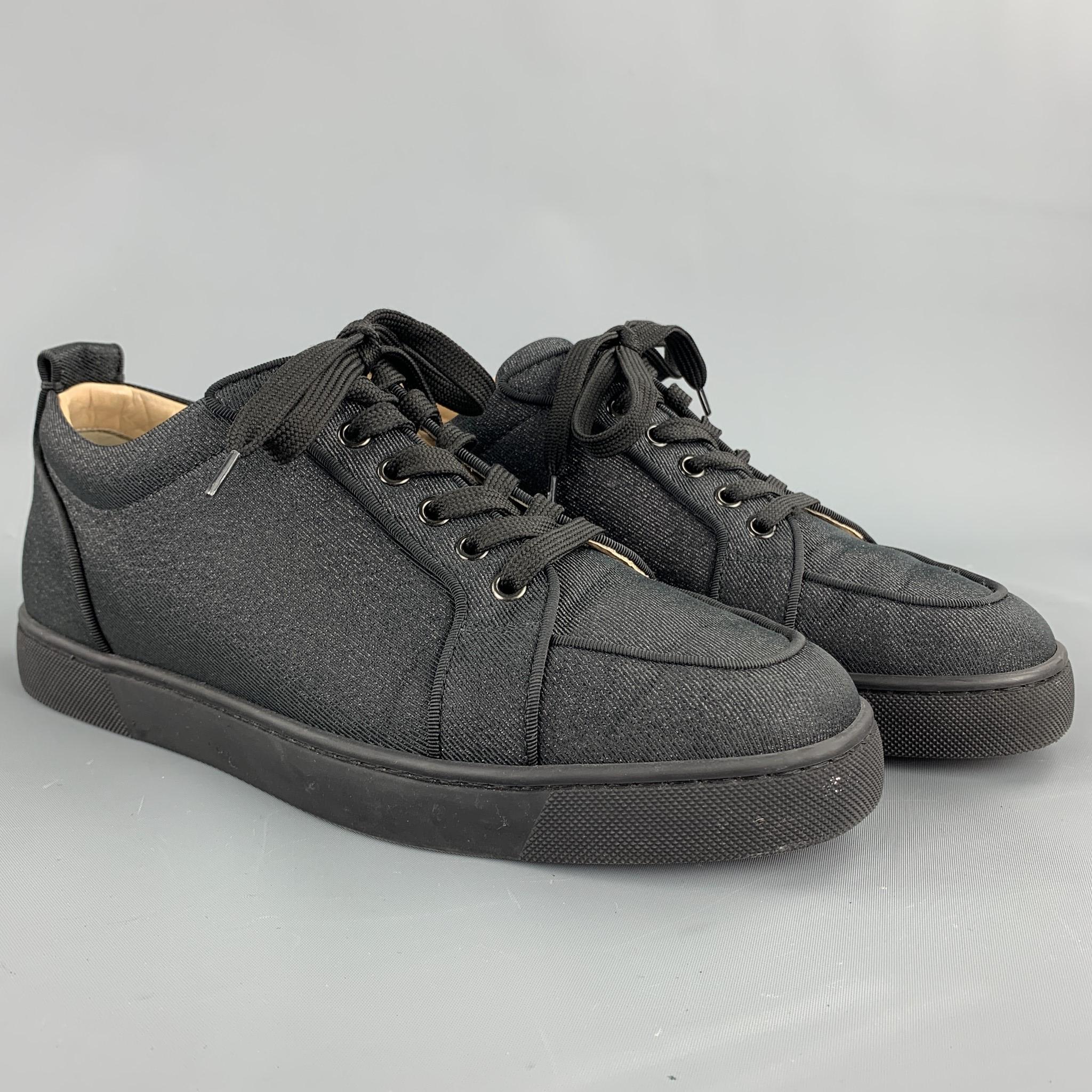 CHRISTIAN LOUBOUTIN sneakers comes in a black lurex denim featuring red rubber sole and a lace up closure. Comes with box. 

Excellent Pre-Owned Condition.
Marked: EU 42
Original Retail Price: $795.00

Outsole:

11 in. x 4 in. 