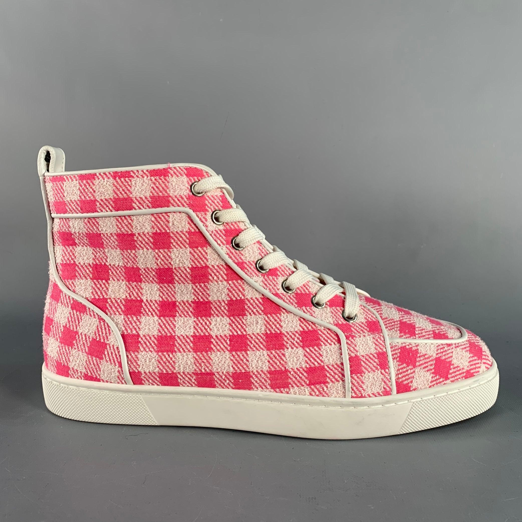 CHRISTIAN LOUBOUTIN sneakers comes in a pink and white checkered tweed material featuring high-top, signature red sole, and a lace up closure. Made in Italy.Excellent Pre-Owned Condition.  

Marked:   42 Outsole: 11 inches  x 4 inches  

  
  
