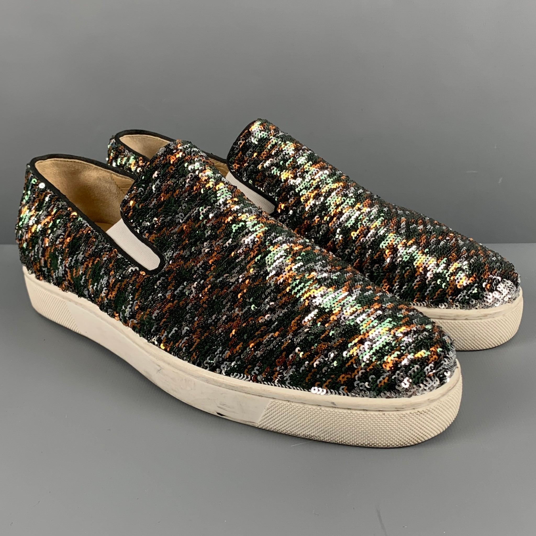 CHRISTIAN LOUBOUTIN sneakers covered in silver mermaid sequins, which when flipped to the other side, reveals a multi-color plaid pattern. These shoes feature a slip on style, and signature Louboutin red sole.Excellent Pre-Owned Condition. 

Marked: